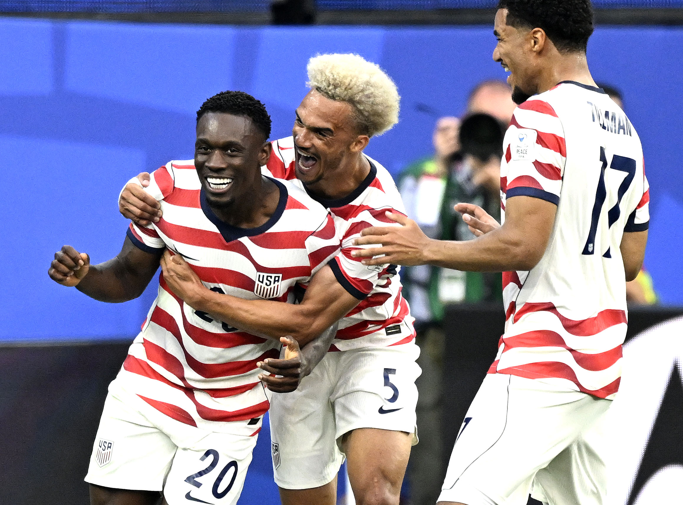 Inglewood, CA - June 12: The United States Folarin Balogun (20) celebrates after scoring with teammates Antonee Robinson (5) and Malik Tillman (17) giving the U.S. a 2-0 first half lead over Paraguay during the FIFA 2026 World Cup at Los Angeles Stadium  in Inglewood on Friday, June 12, 2026. The United States defeated Paraguay 4-1 in the opening U.S. game at the FIFA 2026 World Cup. (Photo by Will Lester/MediaNews Group/Inland Valley Daily Bulletin via Getty Images)
