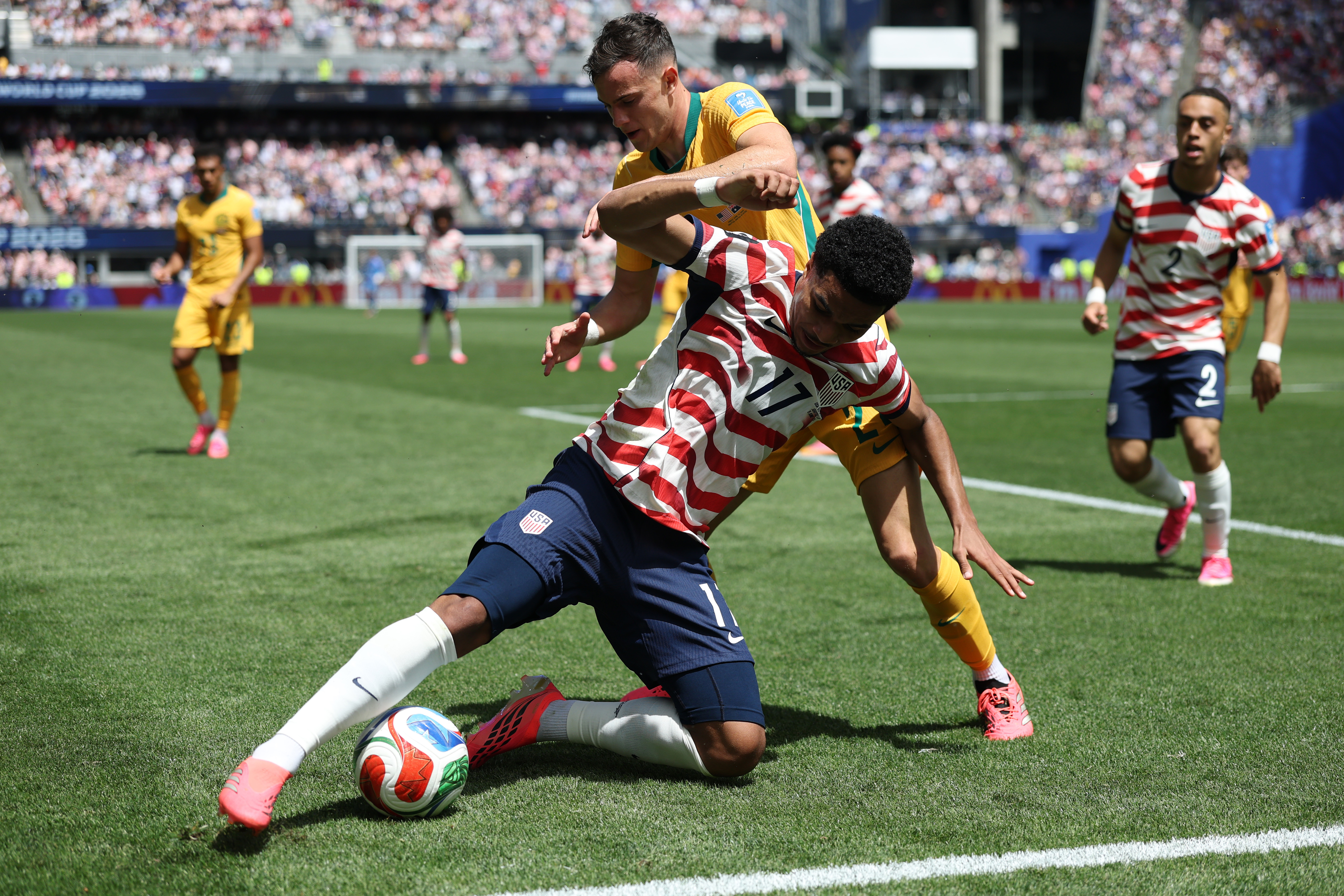 SEATTLE, WASHINGTON - JUNE 19: Malik Tillman #17 of the United States is fouled by Paul Okon-Engstler #24 of Australia during the FIFA World Cup 2026 Group D match between USA and Australia at Seattle Stadium on June 19, 2026 in Seattle, Washington. (Photo by Emilee Chinn/Getty Images)