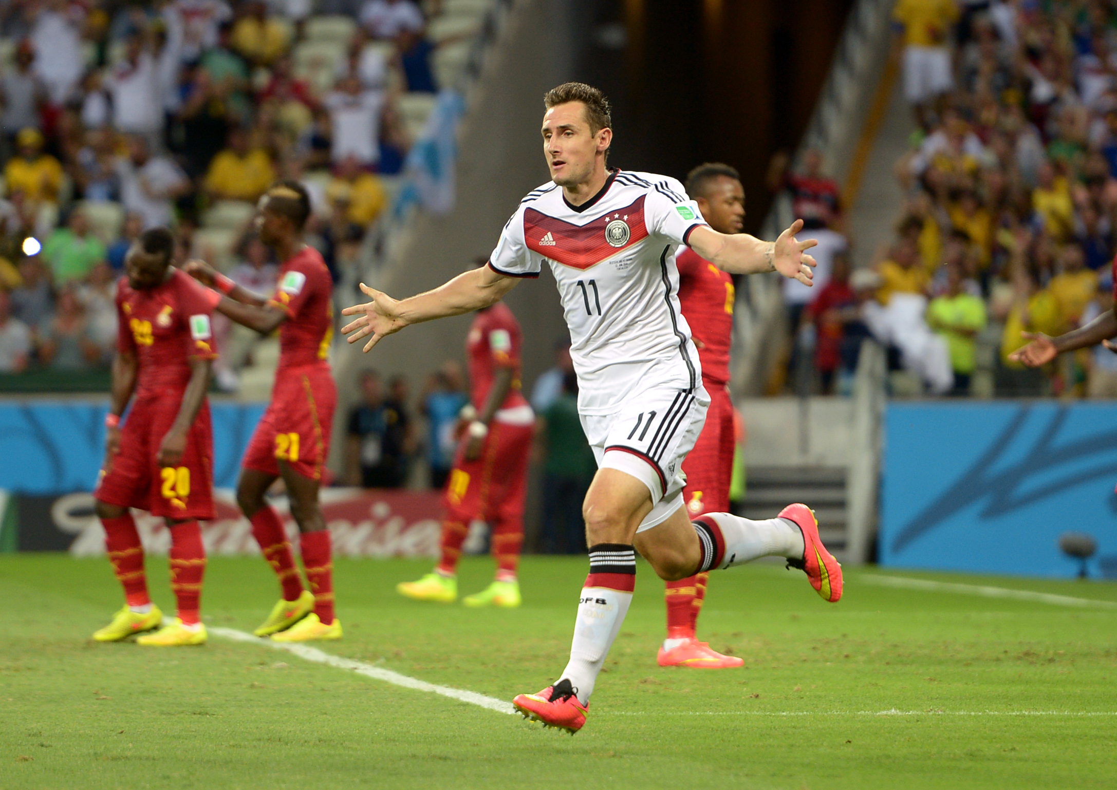 Germany's Miroslav Klose (left) celebrates scoring their second goal with teammate Thomas Muller