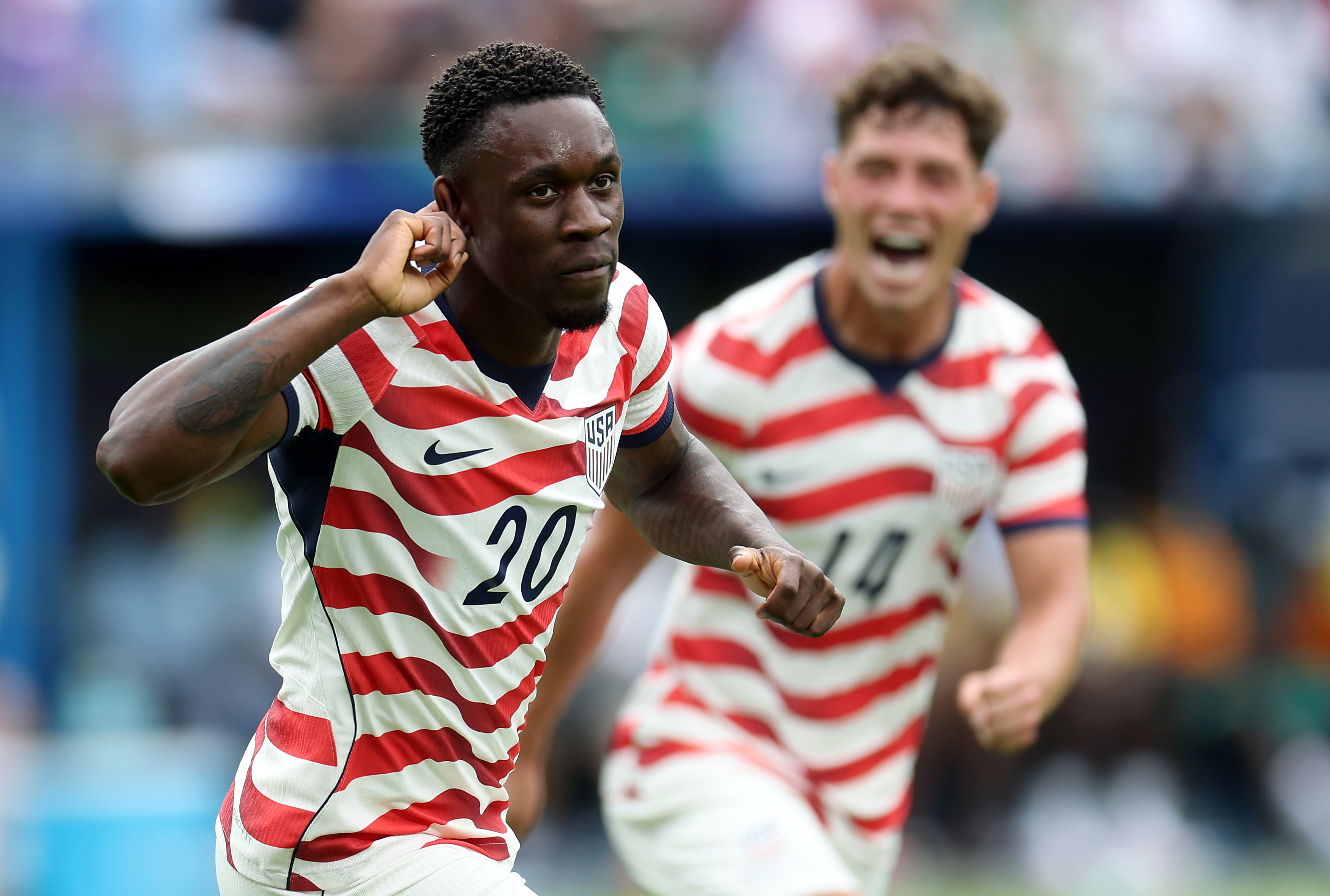 CHARLOTTE, NORTH CAROLINA - MAY 31: Folarin Balogun #20 of United States celebrates as Sebastian Berhalter #14 reacts after scoring his team's third goal during the international friendly match between United States and Senegal at Bank of America Stadium on May 31, 2026 in Charlotte, North Carolina. (Photo by Jamie Squire/Getty Images)