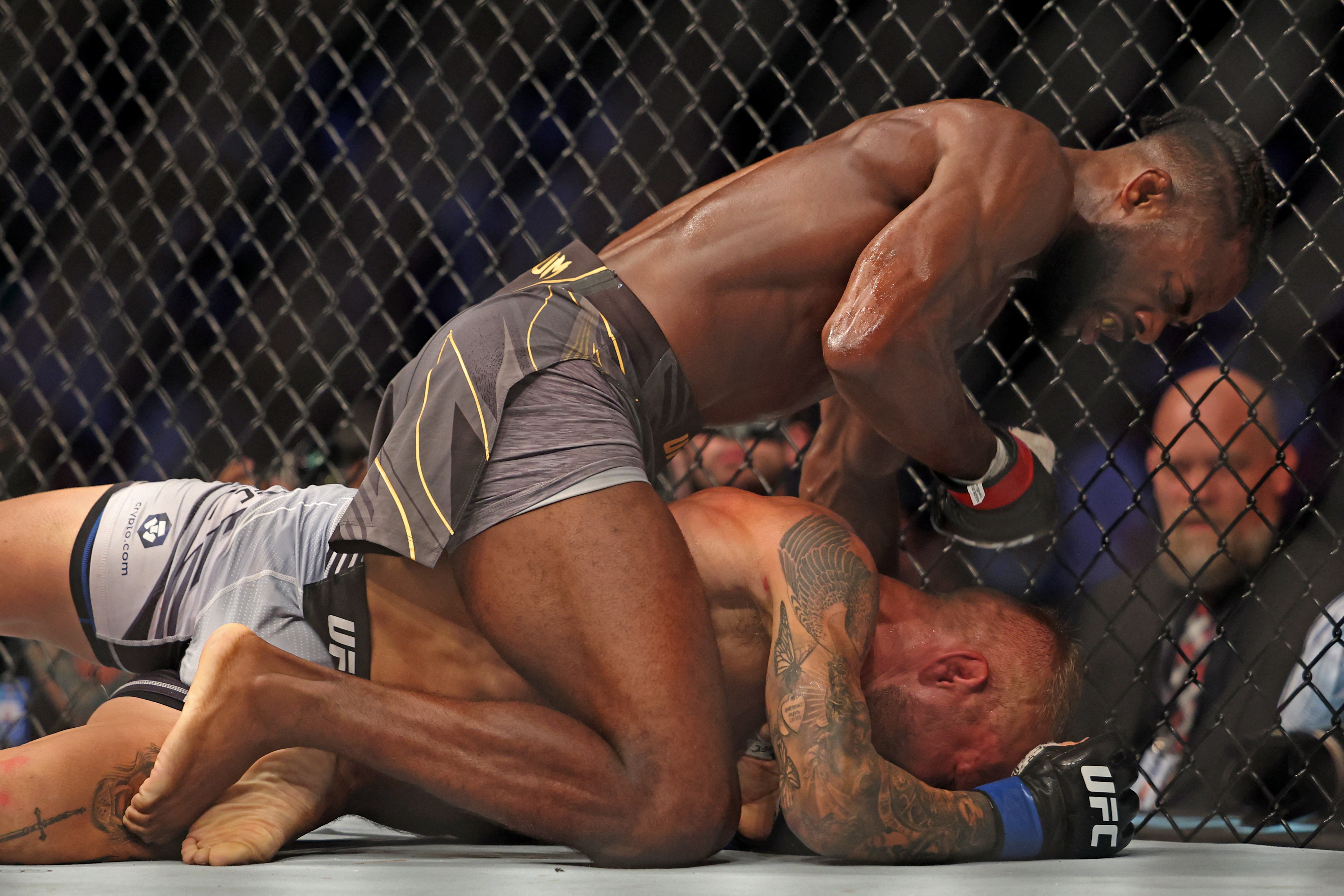 Aljamain Sterling (L) competes against TJ Dillashaw in the bantamweight championship at the Ultimate Fighting Championship (UFC) event at the Etihad Arena in Abu Dhabi on October 22, 2022. (Photo by Giuseppe CACACE / AFP via Getty Images)