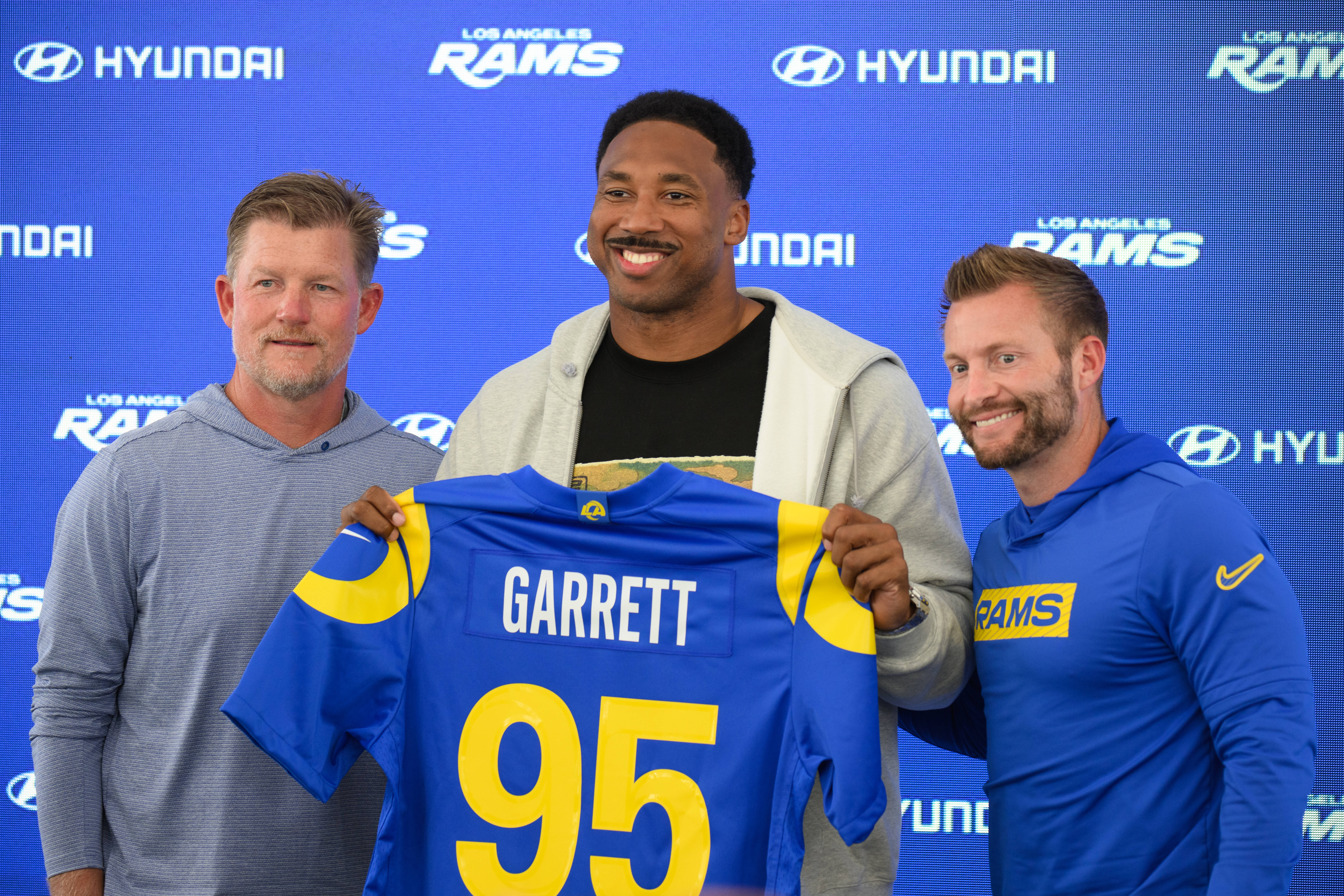 It was all smiles on Tuesday as Les Snead left, and Sean McVay, right, introduced Myles Garrett.