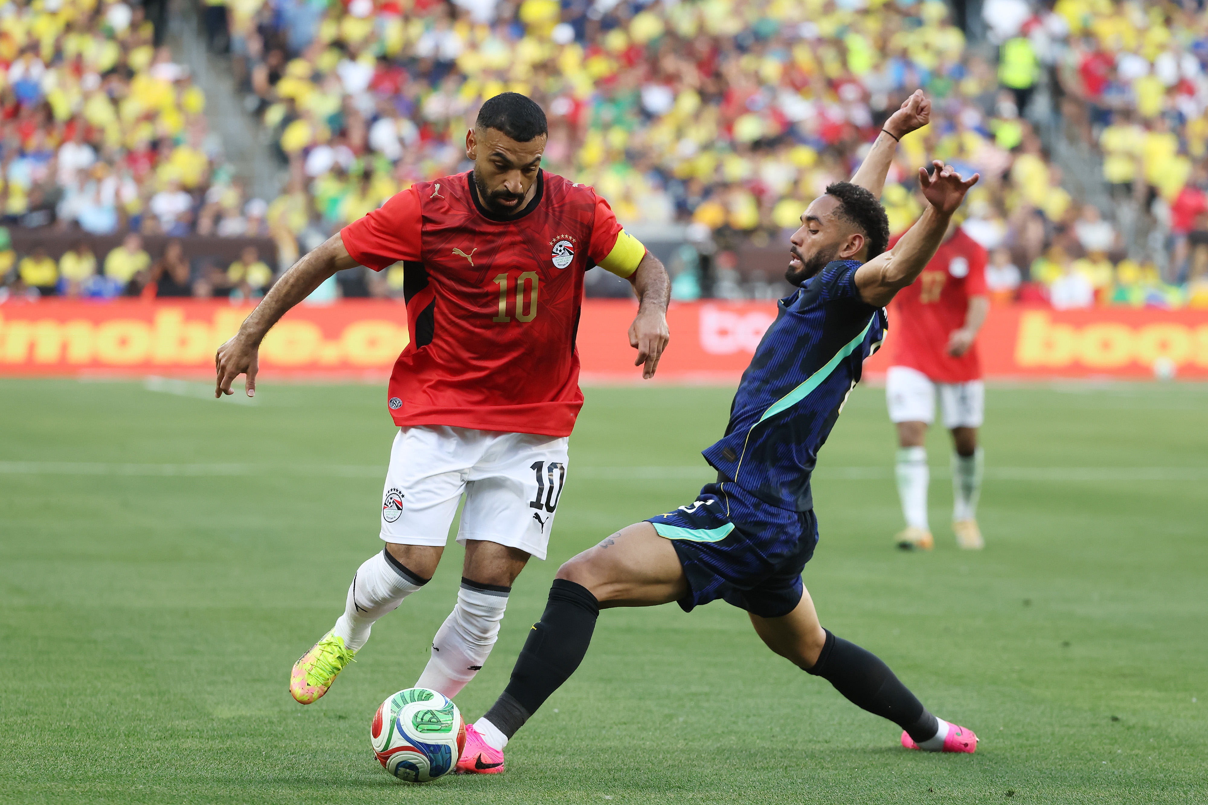 CLEVELAND, OHIO - JUNE 06: Mohamed Salah of Egypt competes for the ball against Matheus Cunha of Brazil during the international friendly match between Brazil and Egypt at Huntington Bank Field on June 06, 2026 in Cleveland, Ohio. (Photo by Kirk Irwin/Getty Images)