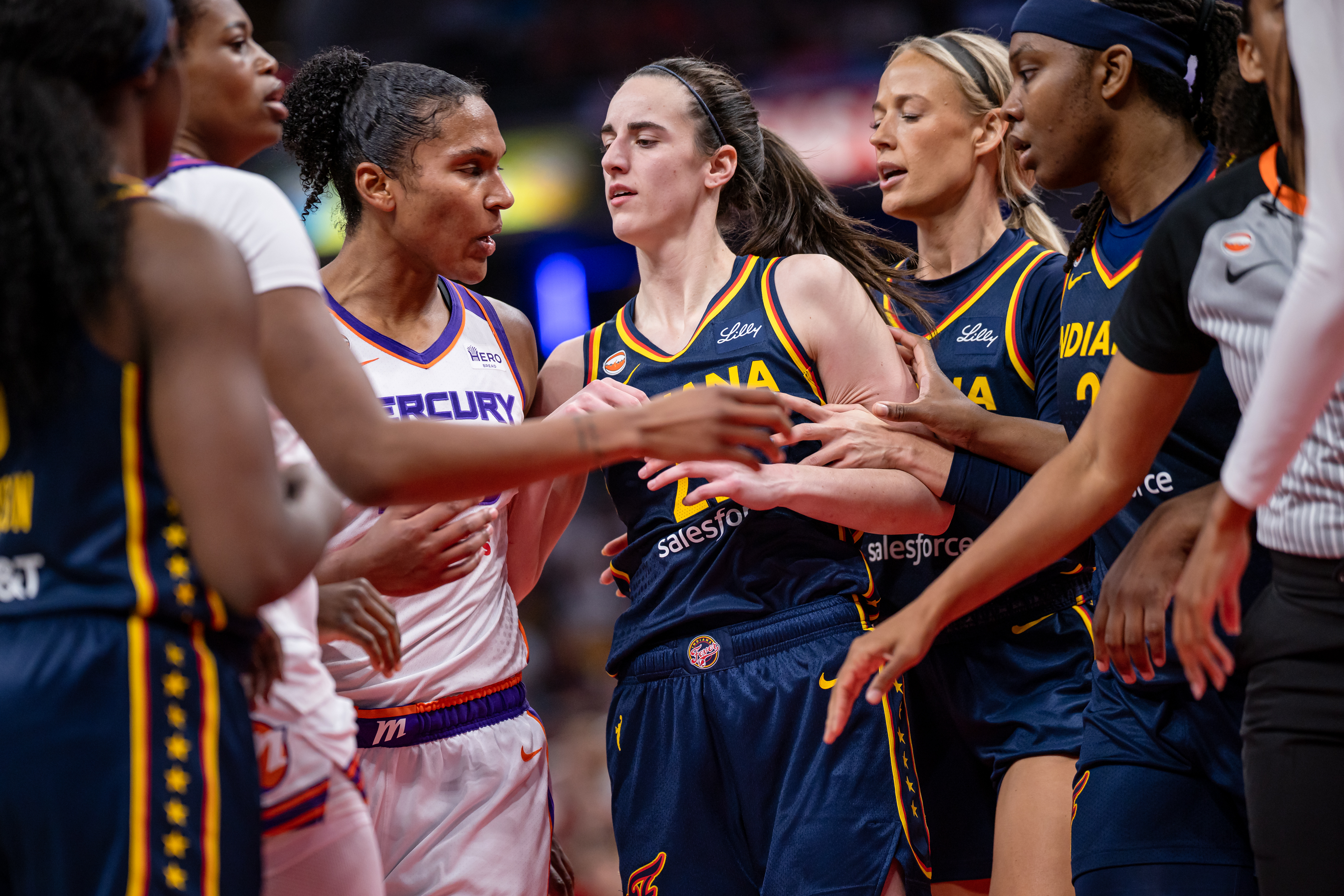 INDIANAPOLIS, INDIANA - JUNE 22: Alyssa Thomas #25 of the Phoenix Mercury and Caitlin Clark #22 of the Indiana Fever get into a scuffle during the game at Gainbridge Fieldhouse on June 22, 2026 in Indianapolis, Indiana. NOTE TO USER: User expressly acknowledges and agrees that, by downloading and or using this photograph, User is consenting to the terms and conditions of the Getty Images License Agreement. (Photo by Michael Hickey/Getty Images)
