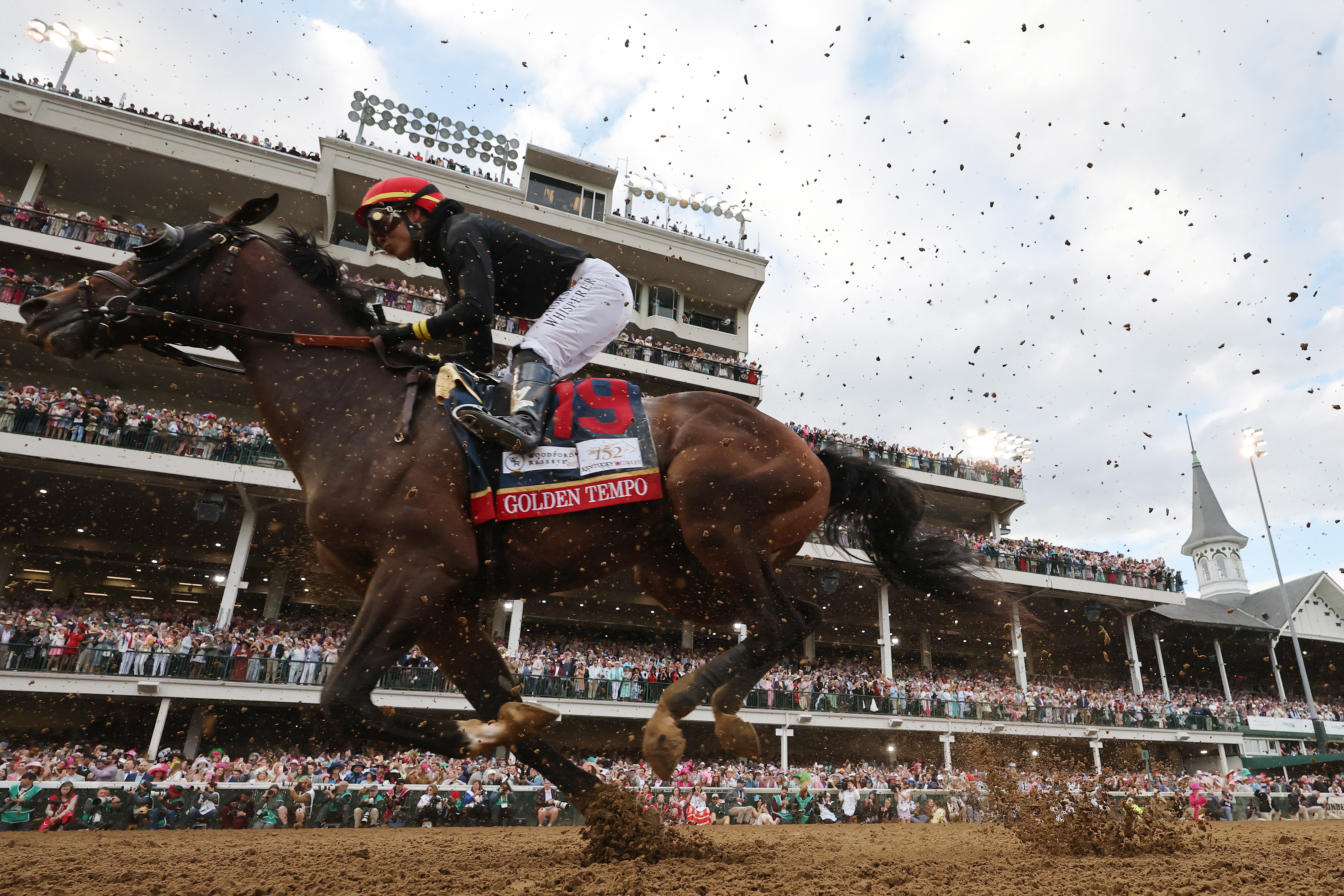 LOUISVILLE, KENTUCKY - MAY 02: Golden Tempo #19, ridden by jockey Jose Ortiz, heads to the first turn the 152nd running of the Kentucky Derby at Churchill Downs on May 02, 2026 in Louisville, Kentucky. (Photo by Michael Reaves/Getty Images)