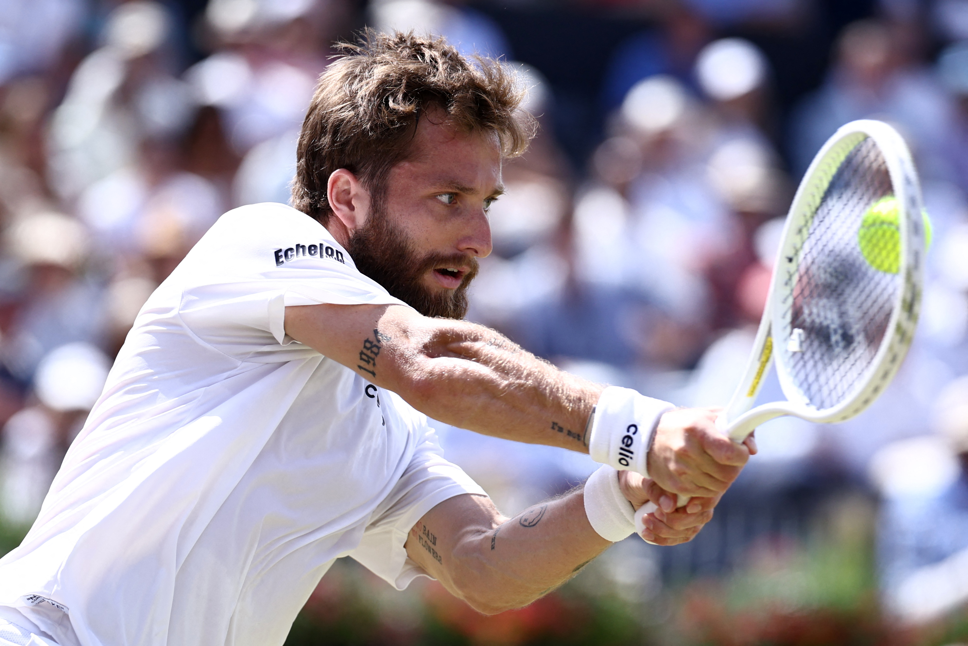 France's Corentin Moutet returns against France's Giovanni Mpetshi Perricard during their men's singles round of 32 tennis match on day two of the ATP HSBC Championships at Queen's Club in west London on June 16, 2026. (Photo by Henry NICHOLLS / AFP via Getty Images)