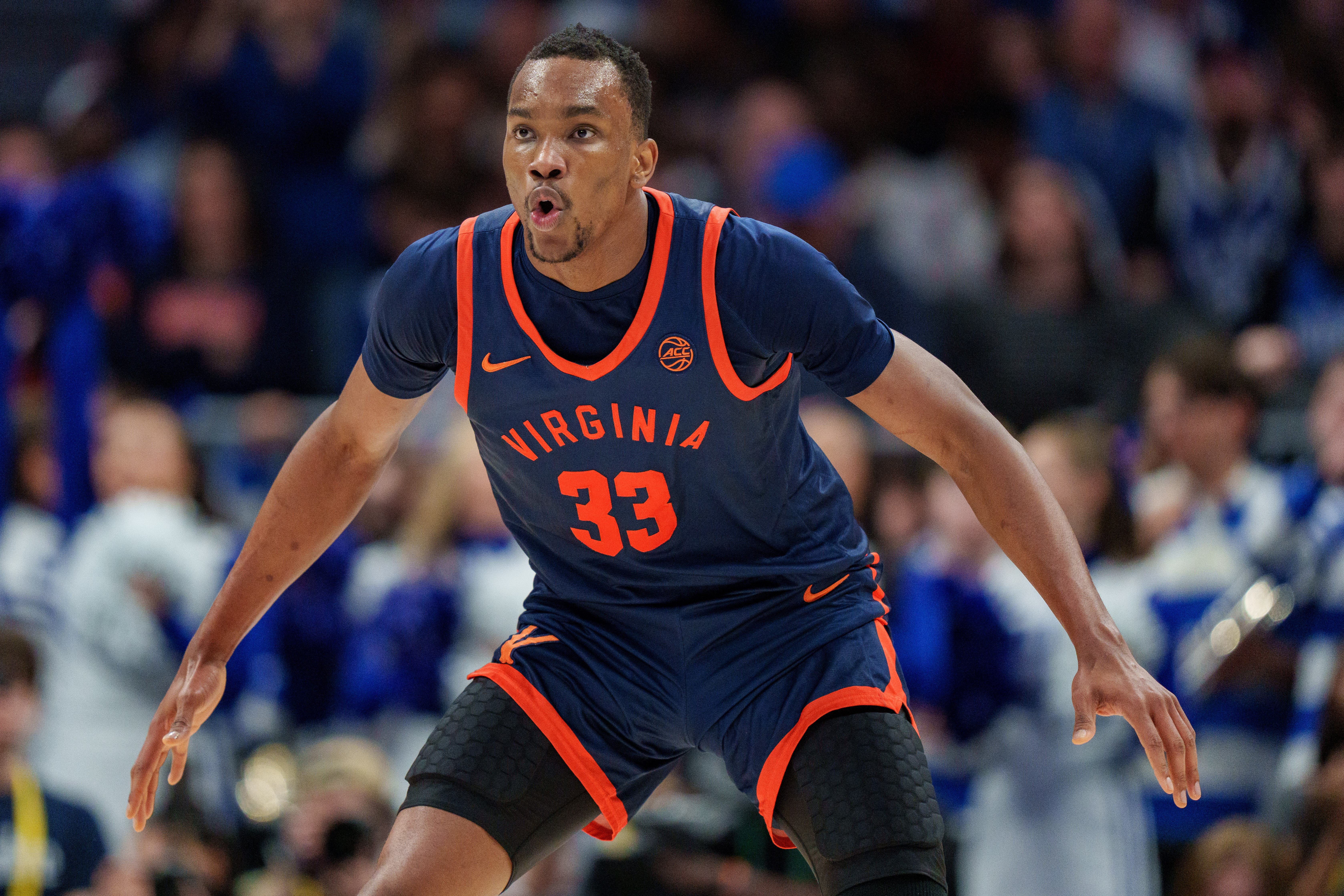 CHARLOTTE, NORTH CAROLINA - MARCH 14: Ugonna Onyenso #33 of the Virginia Cavaliers defends against the Duke Blue Devils during the finals of the men's ACC Tournament at Spectrum Center on March 14, 2026 in Charlotte, North Carolina.  (Photo by Jacob Kupferman/Getty Images)