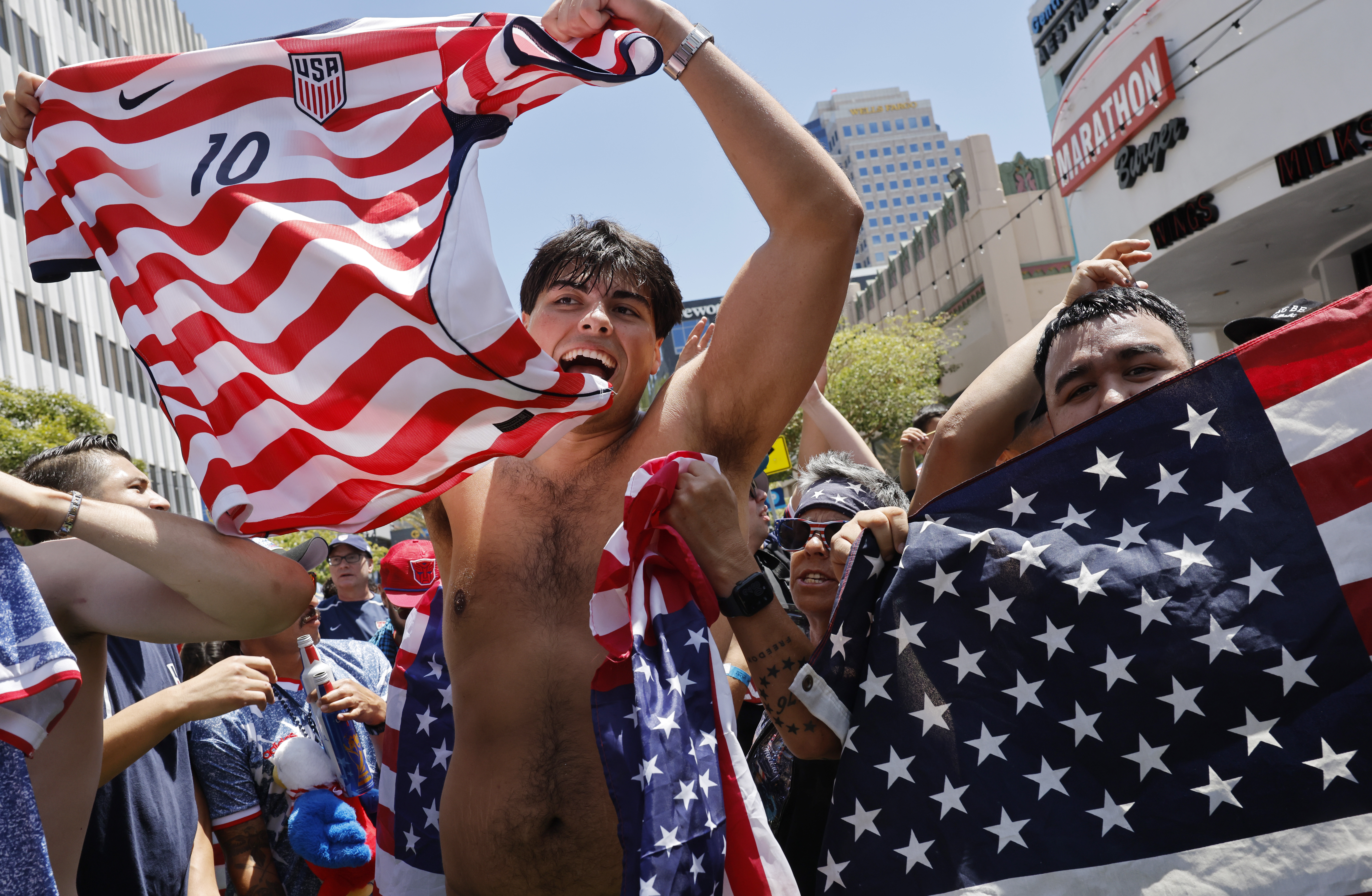 LONG BEACH, CALIFORNIA - JUNE 19: United States soccer fans celebrate after the U.S. defeated Australia 2-0 in their World Cup group stage match, at a watch party hosted by the LA Galaxy, on June 19, 2026 in Long Beach, California. This is the United States' second game at the FIFA World Cup 2026, and Los Angeles is hosting 8 matches during the global tournament. (Photo by Mario Tama/Getty Images)