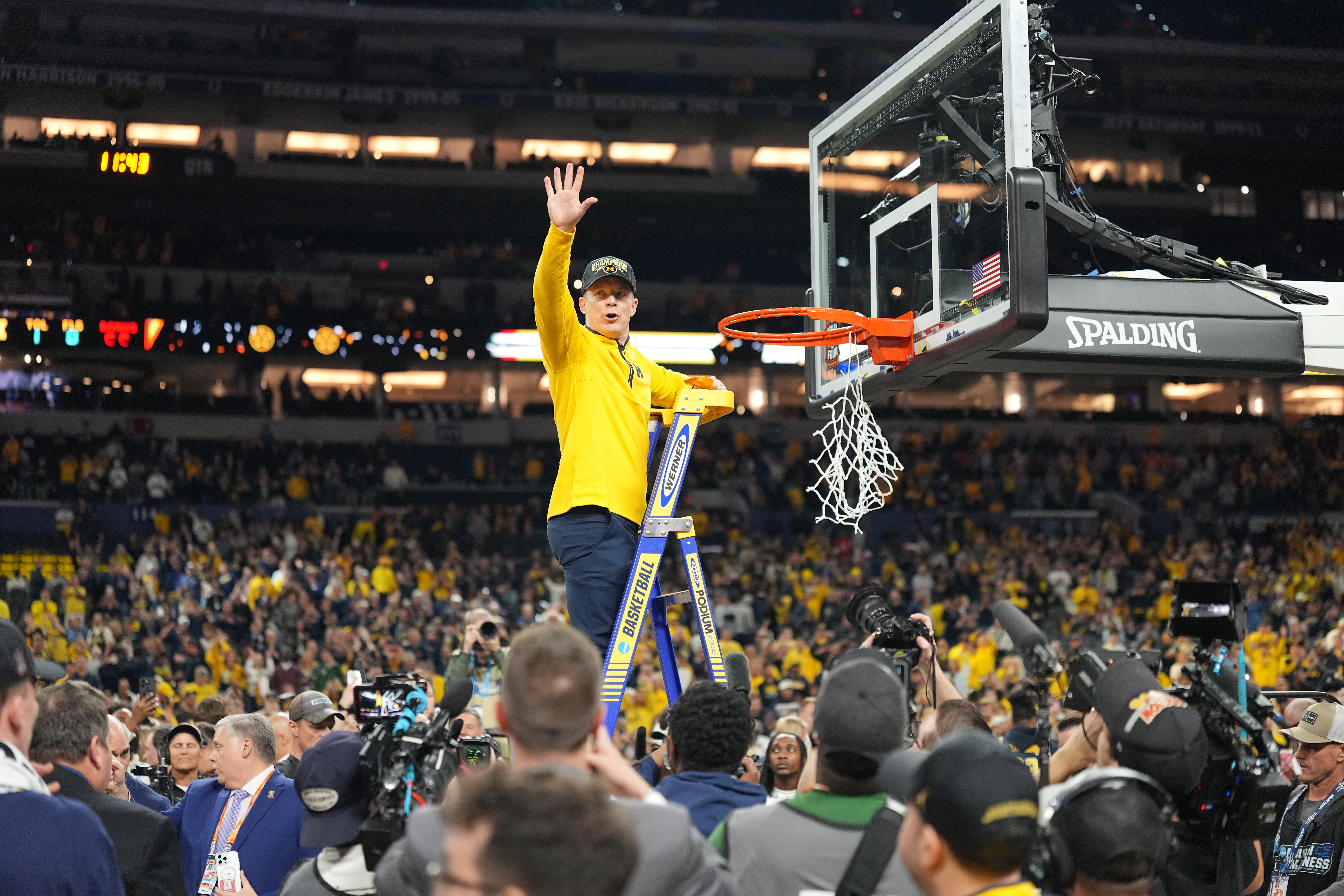 College Basketball: NCAA Finals: Michigan Head Coach Dusty May cuts the net down following victory vs UConn at Lucas Oil Stadium. Indianapolis, IN 4/6/2026 CREDIT: Erick W. Rasco (Photo by Erick W. Rasco/Sports Illustrated via Getty Images) (Set Number: X164879 TK1)
