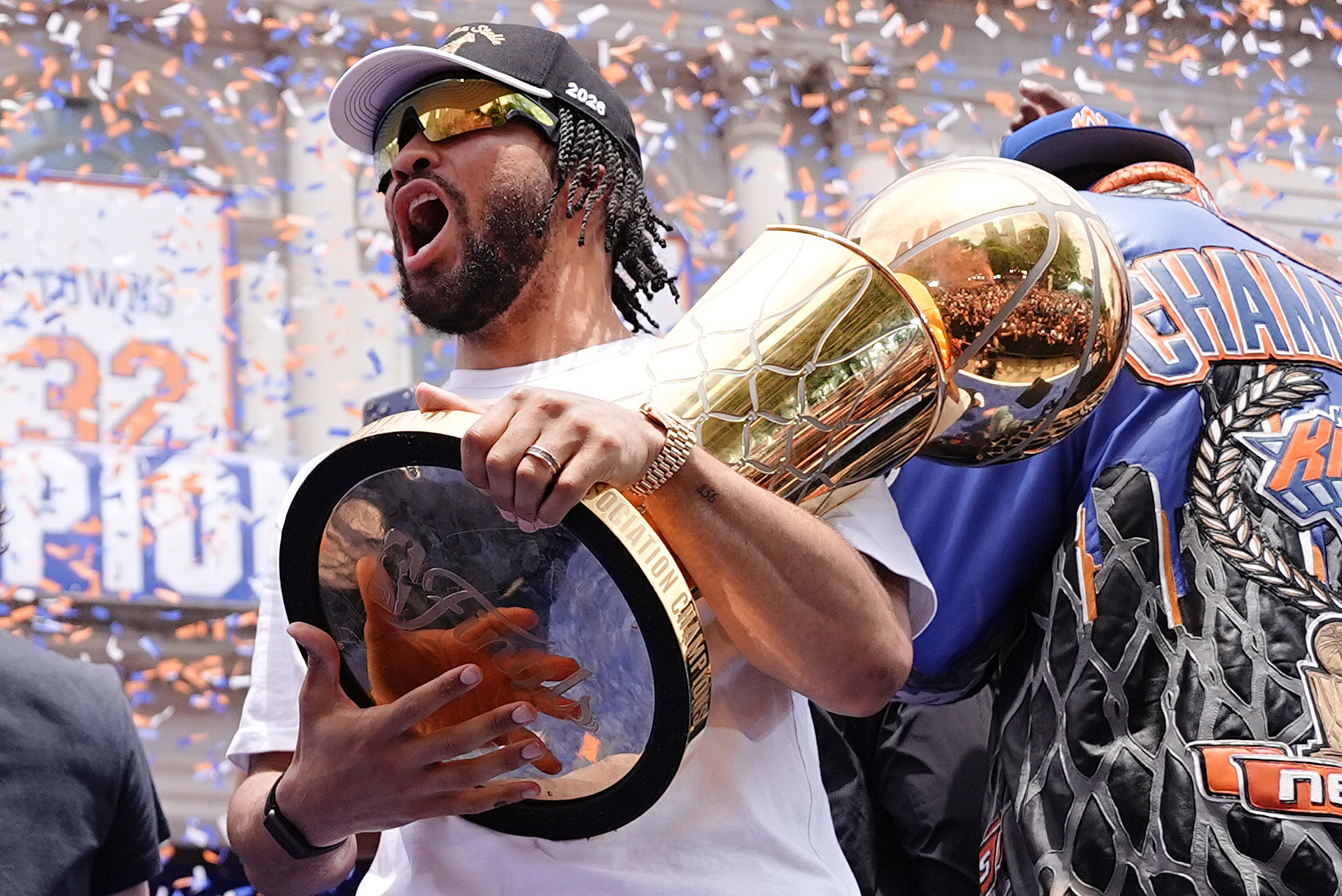 NEW YORK, NEW YORK - JUNE 18: Jalen Brunson #11 of the New York Knicks celebrates with the Larry O'Brien Championship Trophy during the New York Knicks Championship ticker tape parade and victory rally celebrating winning the 2026 NBA Finals on June 18, 2026 in New York City. The New York Knicks defeated the San Antonio Spurs in five games to win their first NBA Championship in 53 years. (Photo by Angelina Katsanis/Getty Images)