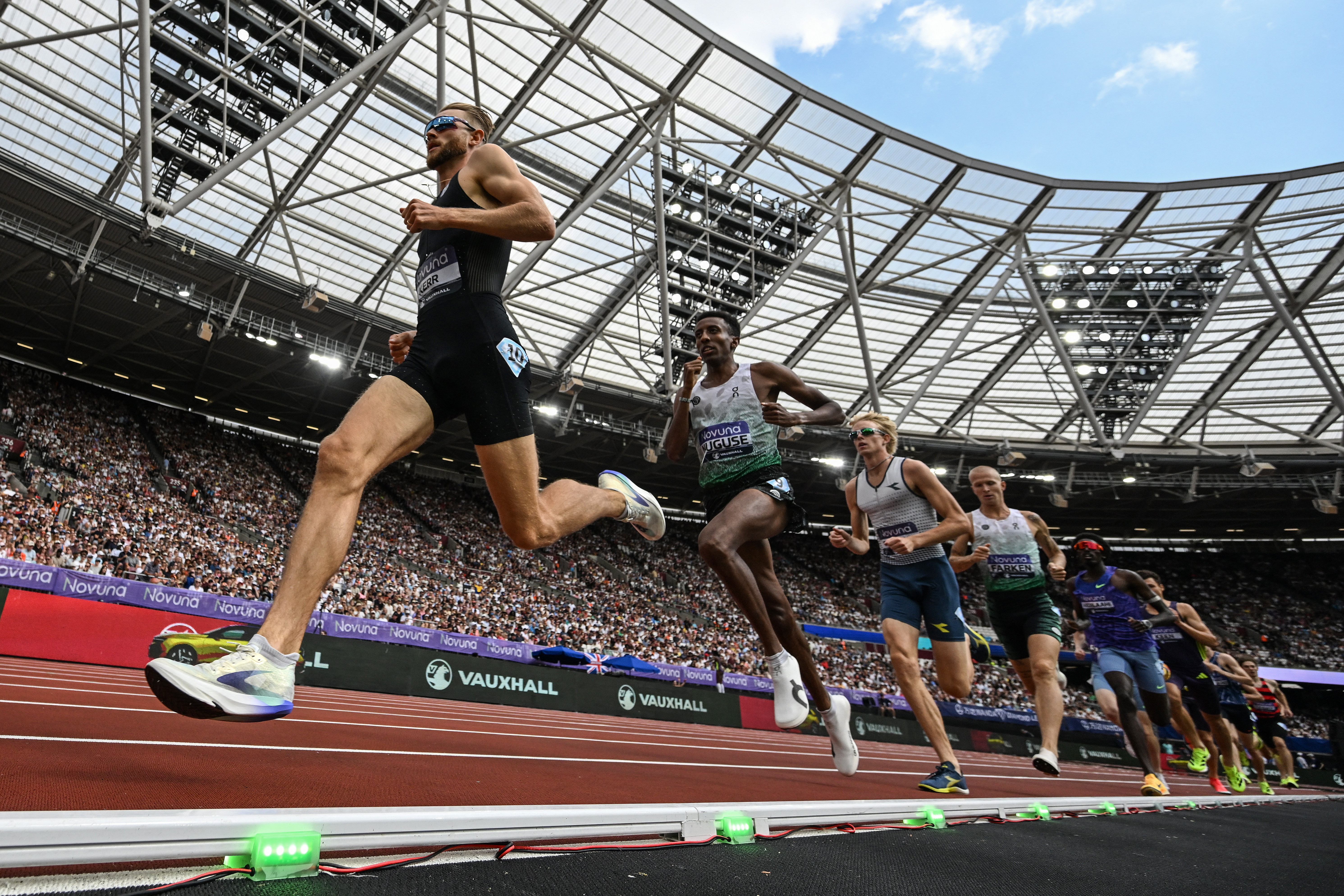 Britain's Josh Kerr (L) competes in the men's one mile event during the IAAF Diamond League athletics competition at the London stadium in London on July 18, 2026. (Photo by Glyn KIRK / AFP via Getty Images)