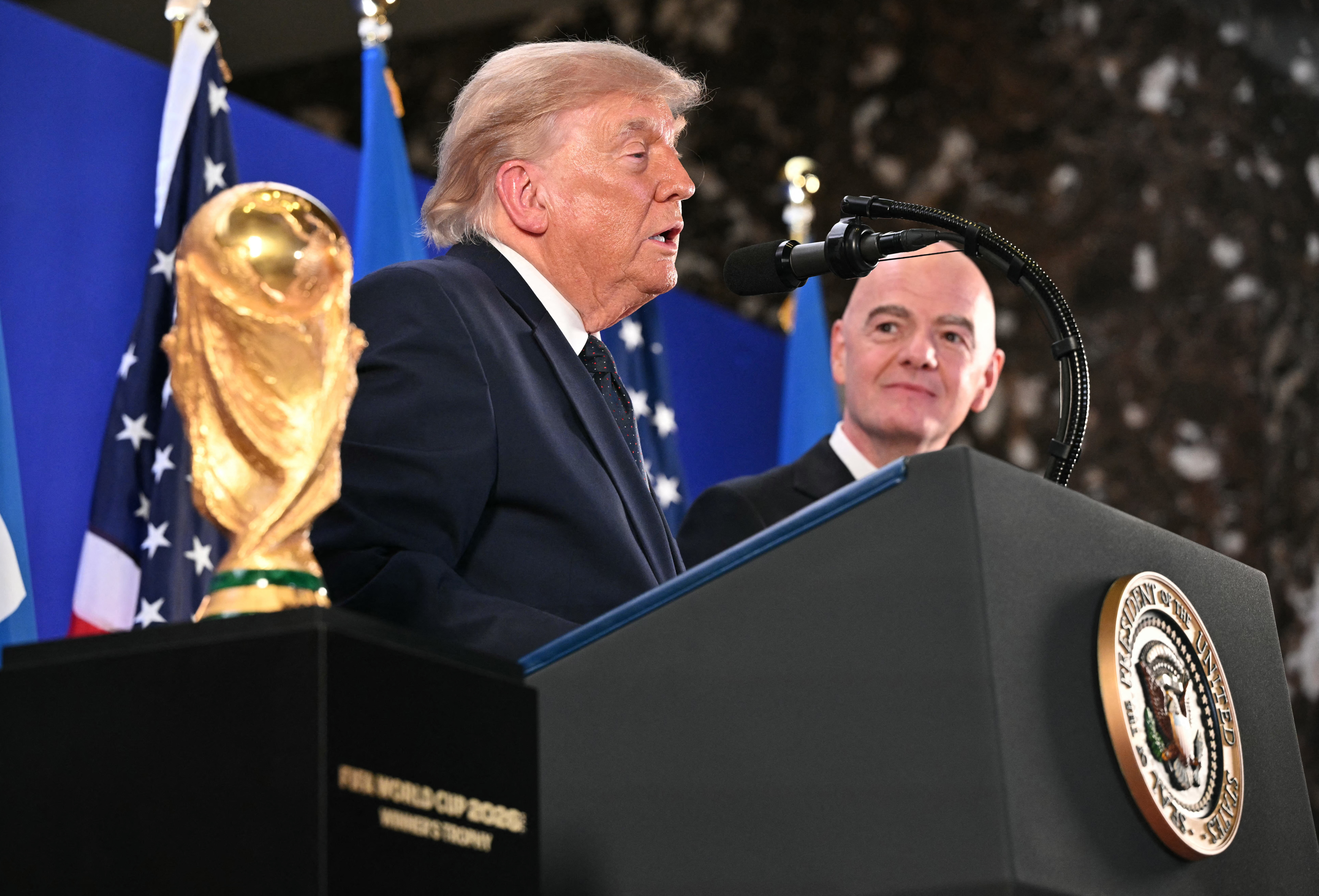 The FIFA World Cup Trophy is displayed as US President Donald Trump speaks next to FIFA President Gianni Infantino during a FIFA reception at Trump Tower in New York on July 17, 2026. President Trump will attend the 2026 World Cup Final between Spain and Argentina. (Photo by Mandel NGAN / AFP via Getty Images)