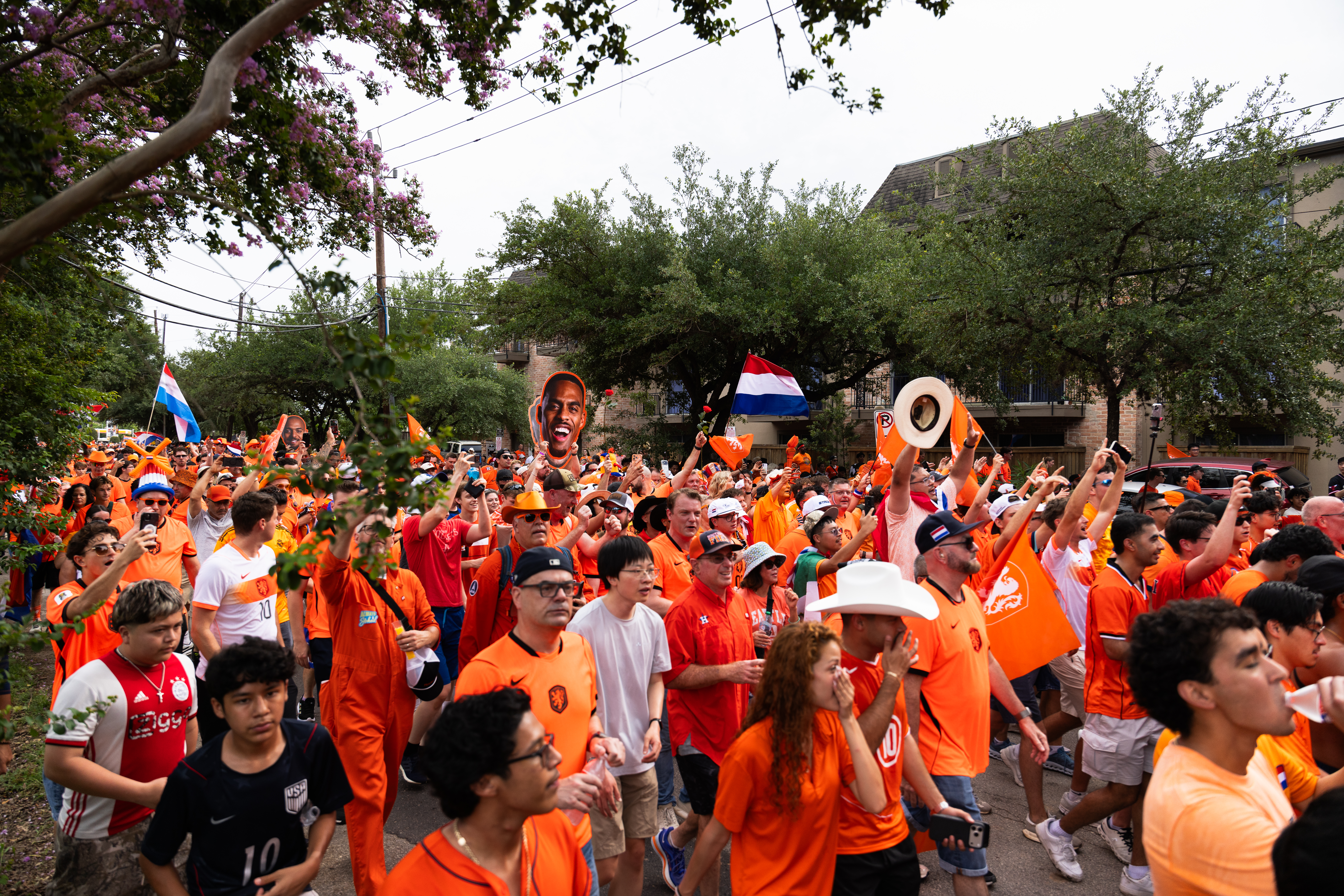 Fans wear orange and march across Houston, Texas, during the Oranje Walk ahead of a World Cup match between the Netherlands and Sweden on June 20, 2026. (Photo by Reginald Mathalone/NurPhoto via Getty Images)