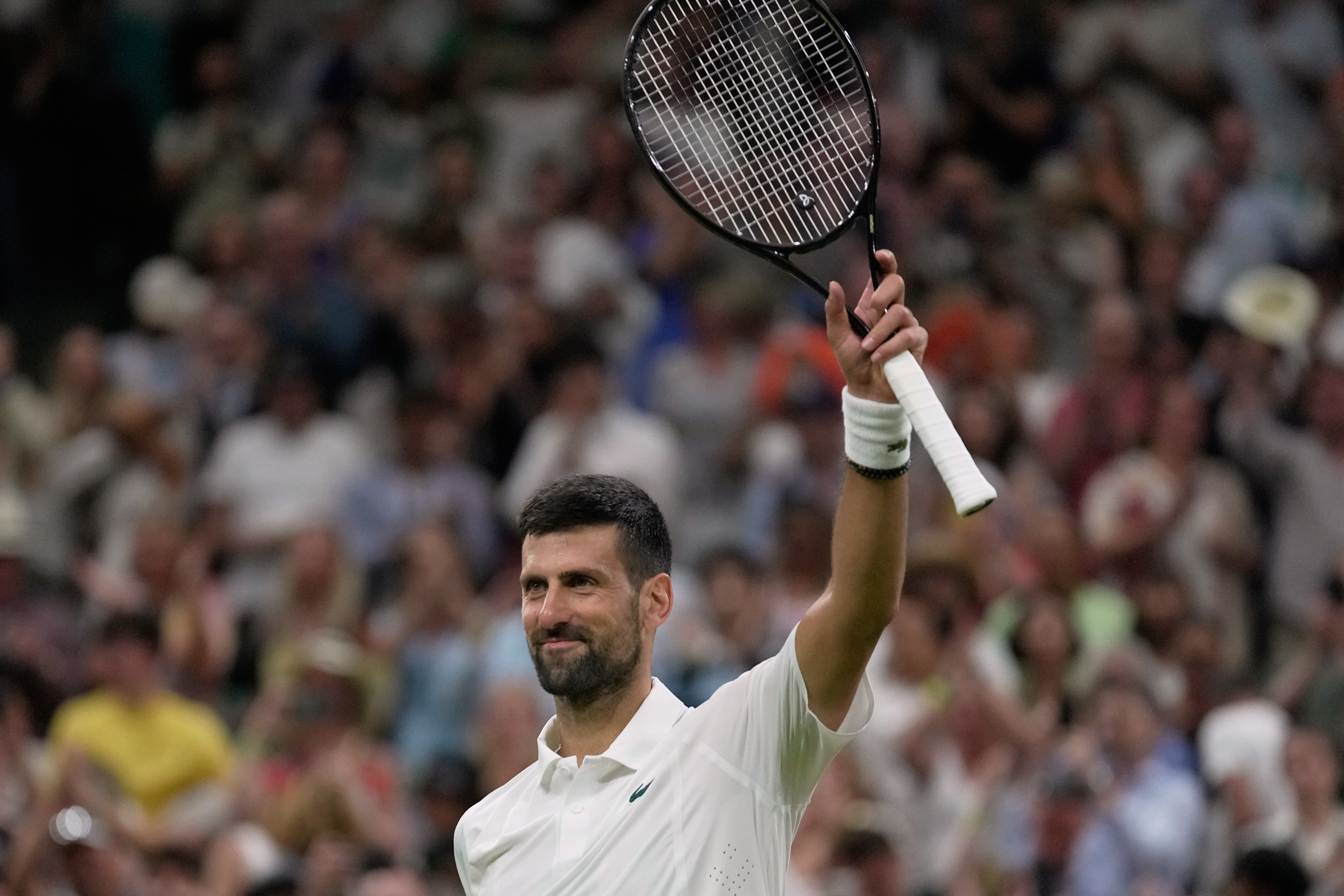 Novak Djokovic of Serbia celebrates his victory against Stefanos Tsitsipas of Greece in their second round men's singles match at the Wimbledon Tennis Championships in London, Wednesday, July 1, 2026. (AP Photo/Brian Inganga)