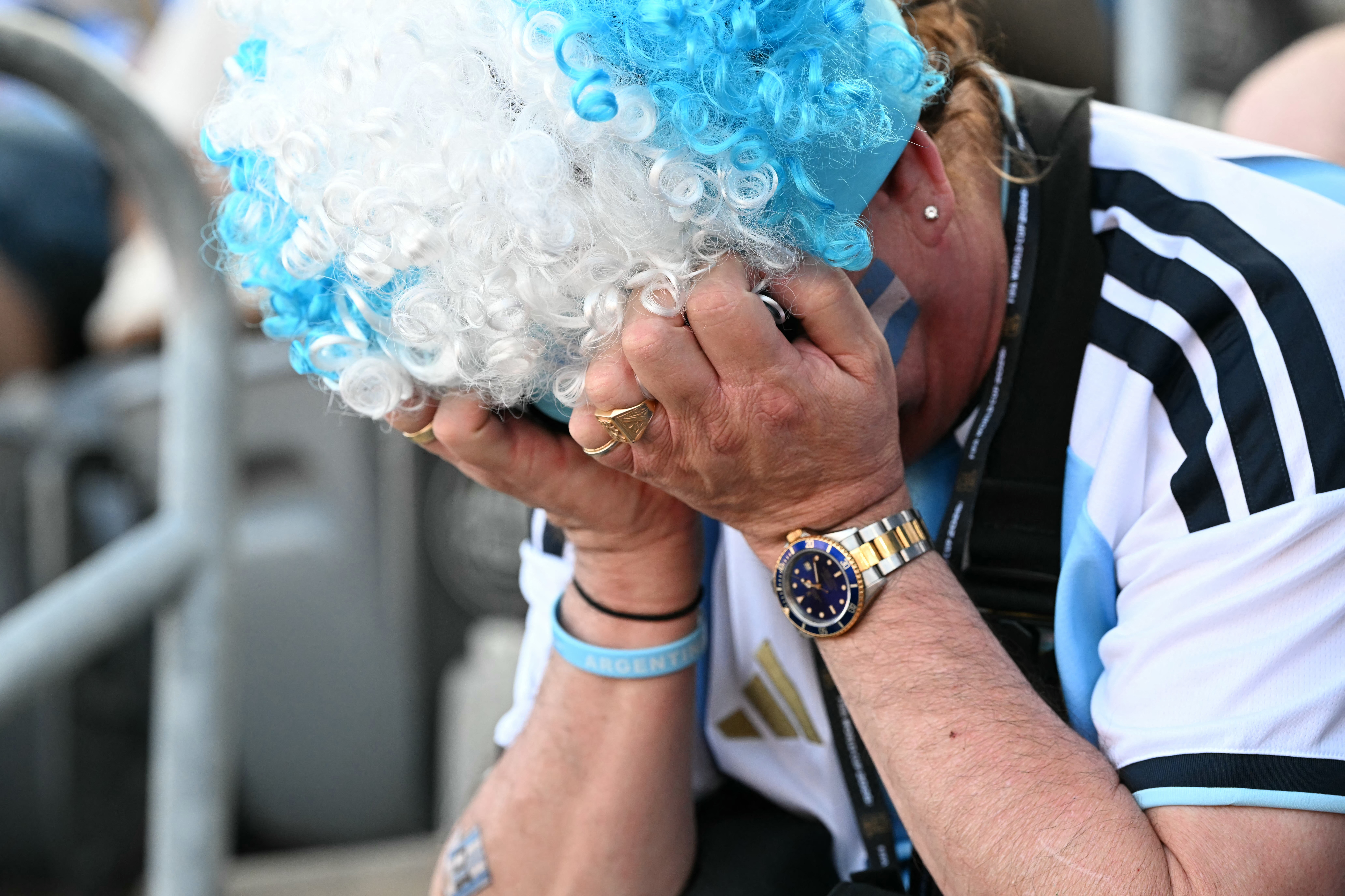 An Argentina fan reacts after his team lost the 2026 World Cup football tournament final match between Spain and Argentina at the New York/New Jersey Stadium in East Rutherford on July 19, 2026.  (Photo by ROBERTO SCHMIDT / AFP via Getty Images)