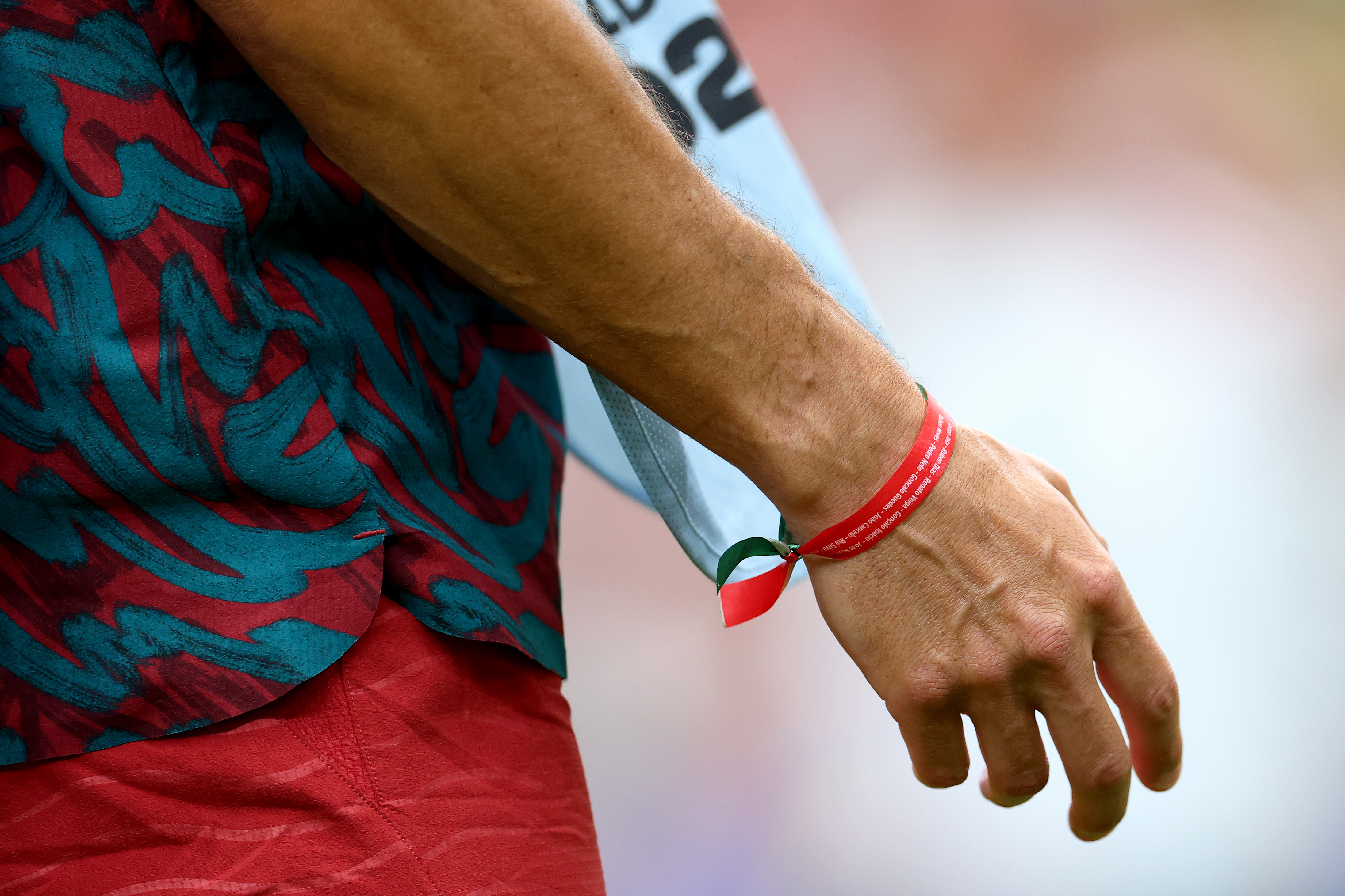 HOUSTON, TEXAS - JUNE 23: A detailed view of the bracelet on the wrist of Cristiano Ronaldo #7 of Portugal (obscured), which is a tribute to former Portuguese international footballer Diogo Jota and was presented to him by the Portuguese Royal Family, as he warms up prior to the FIFA World Cup 2026 Group K match between Portugal and Uzbekistan at Houston Stadium on June 23, 2026 in Houston, Texas. (Photo by Maja Hitij - FIFA/FIFA via Getty Images)