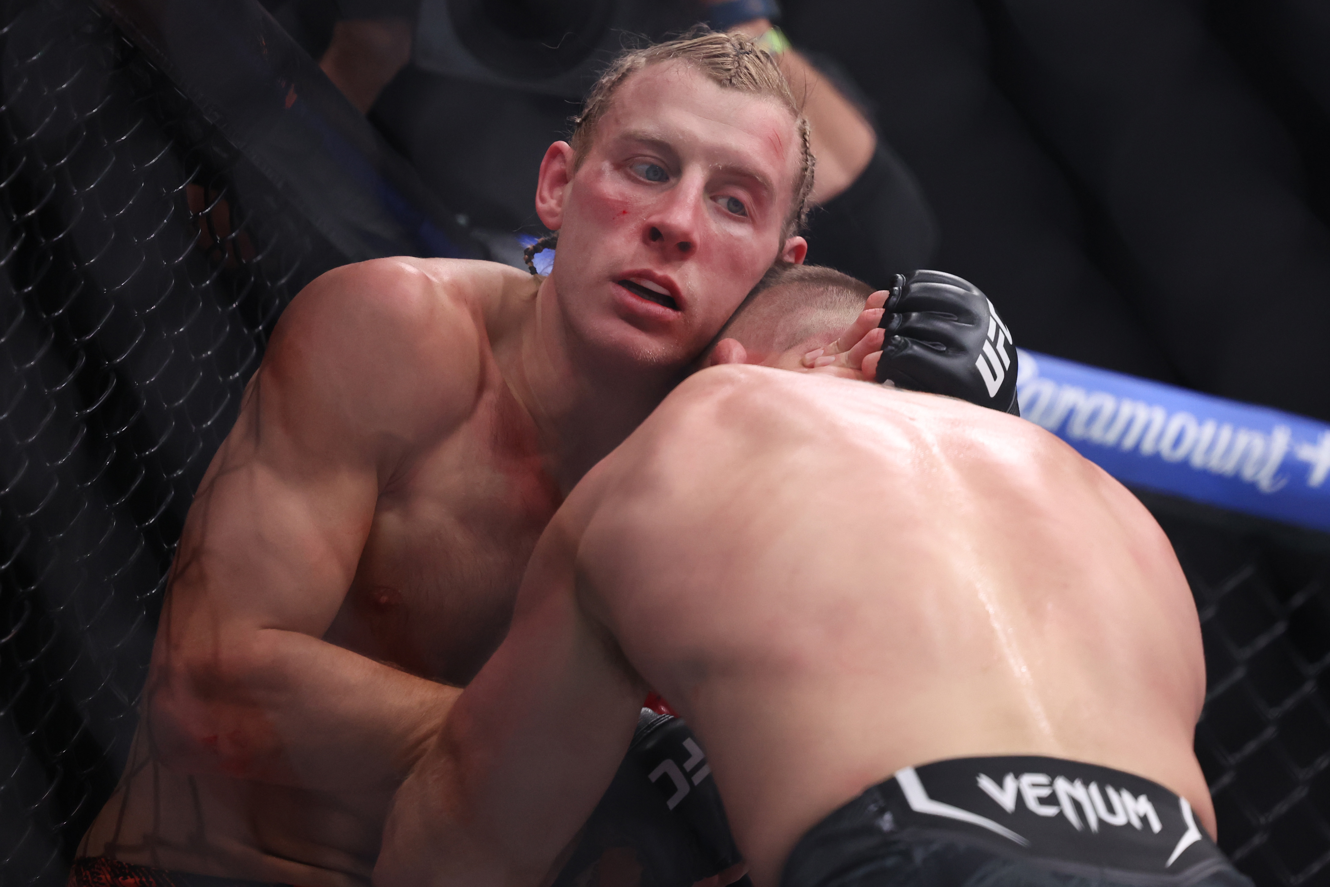 LAS VEGAS, NEVADA - JANUARY 24: Paddy Pimblett of England (L) and Justin Gaethje of the United States come together during their interim lightweight title bout in UFC 324 at T-Mobile Arena on January 24, 2026 in Las Vegas, Nevada. (Photo by Ian Maule/Getty Images)