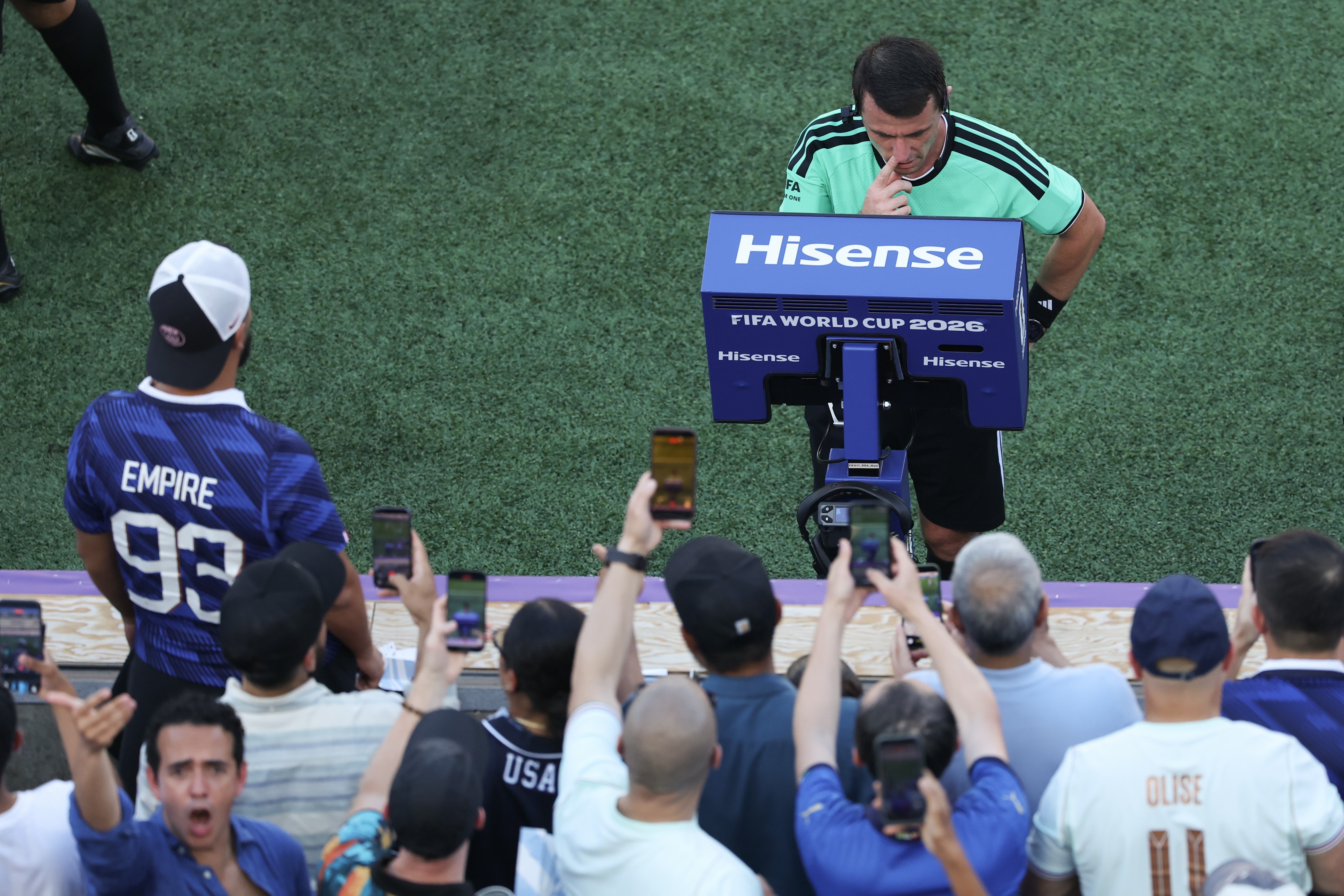 Referee Ilgiz Tantashev back watches the video assistant referee VAR monitor during the round of 16 match between France and Paraguay at the 2026 FIFA World Cup at Philadelphia Stadium in Philadelphia, the United States, July 4, 2026. (Photo by Hu Xingyu/Xinhua via Getty Images)