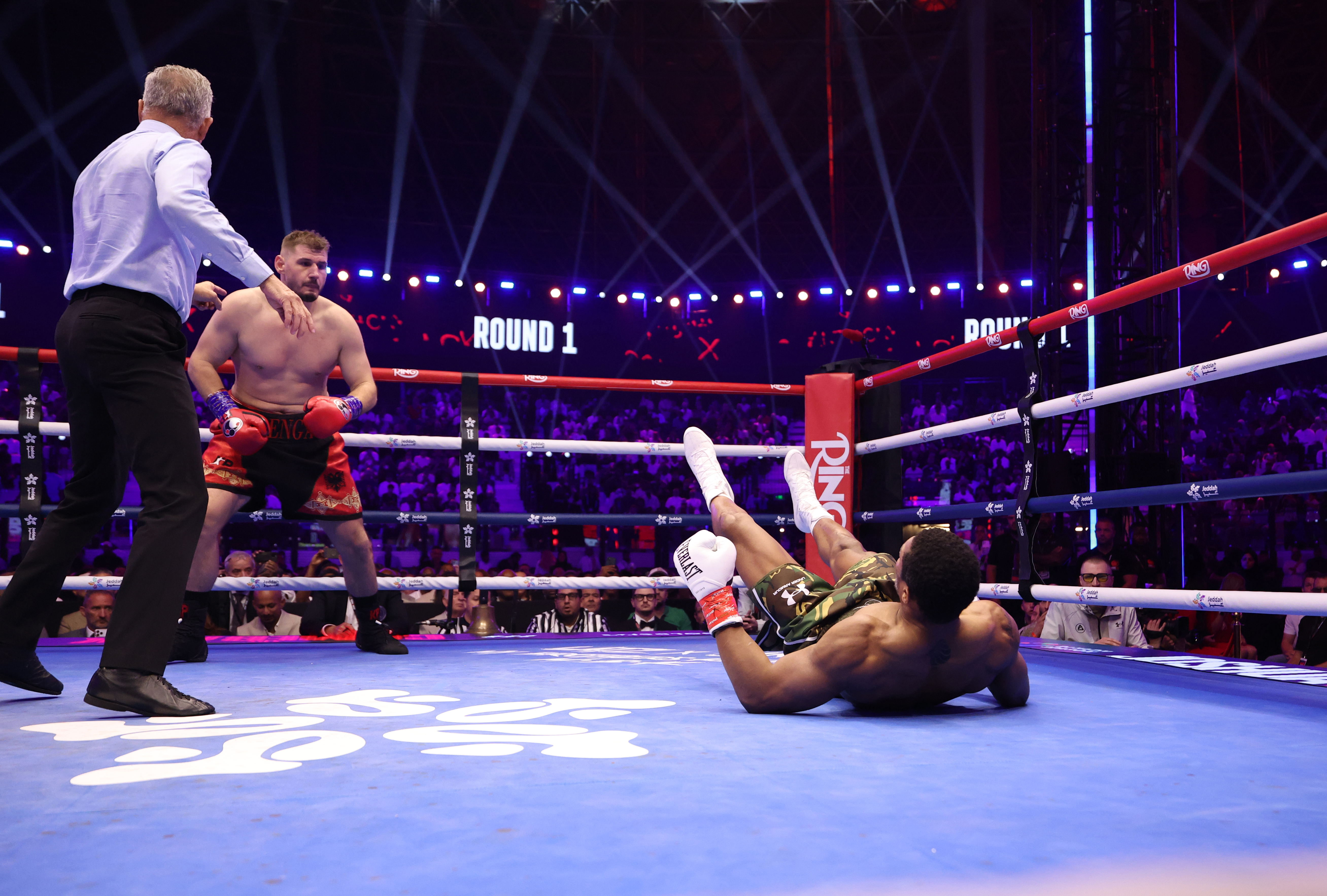 JEDDAH, SAUDI ARABIA - JULY 25: Anthony Joshua (camouflage shorts) and Kristian Prenga (red and black shorts) during their Heavyweight contest  during the Anthony Joshua v Kristian Prenga: The Comeback fight night at Jeddah Superdome on July 25, 2026 in Jeddah, Saudi Arabia. (Photo by Mark Robinson/Matchroom Boxing/Getty Images)
