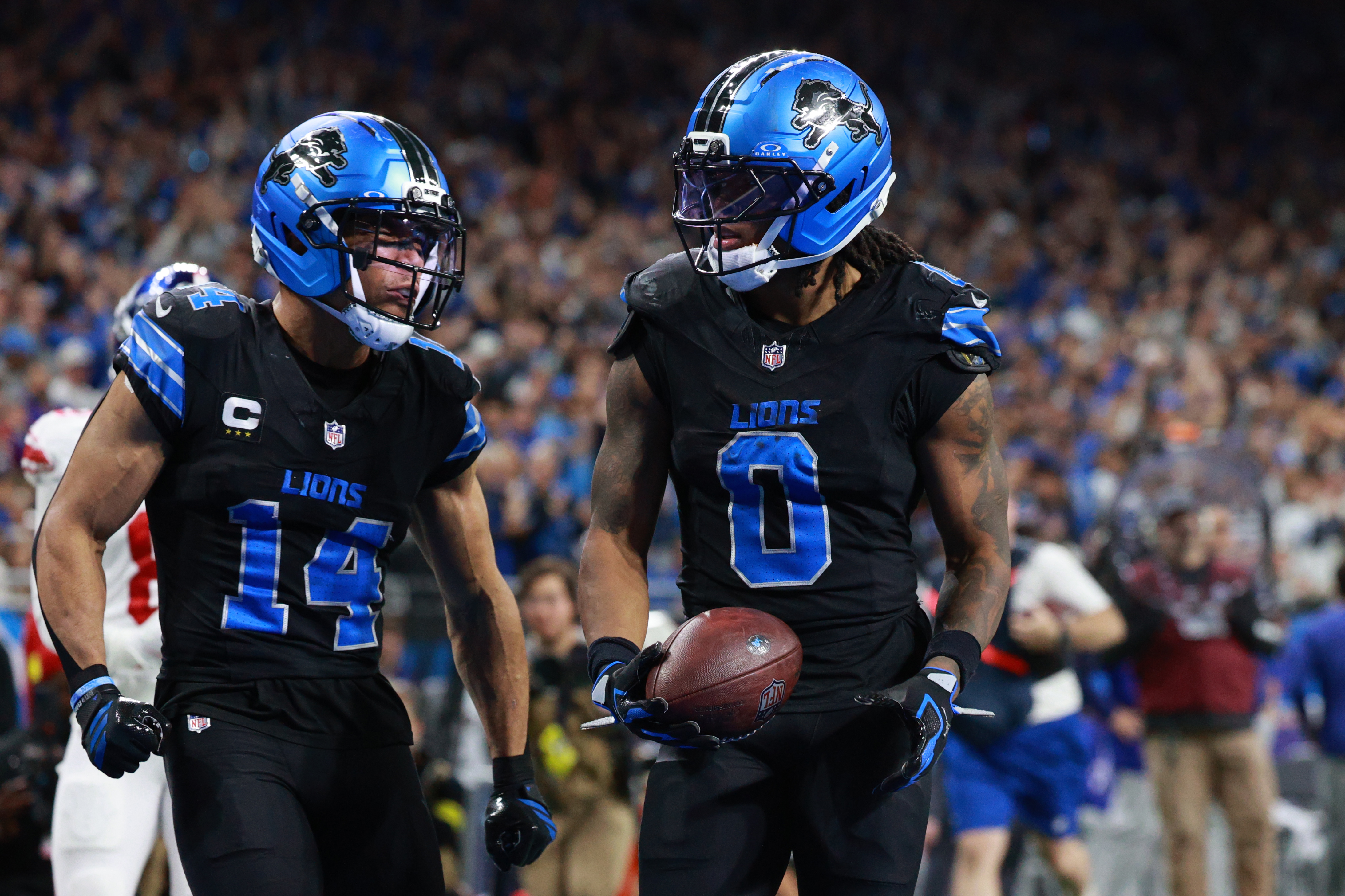 Detroit Lions running back Jahmyr Gibbs (0) and receiver Amon-Ra St. Brown (14) lead a talented team looking to make up for a disappointing season. (Photo by Jorge Lemus/NurPhoto via Getty Images)