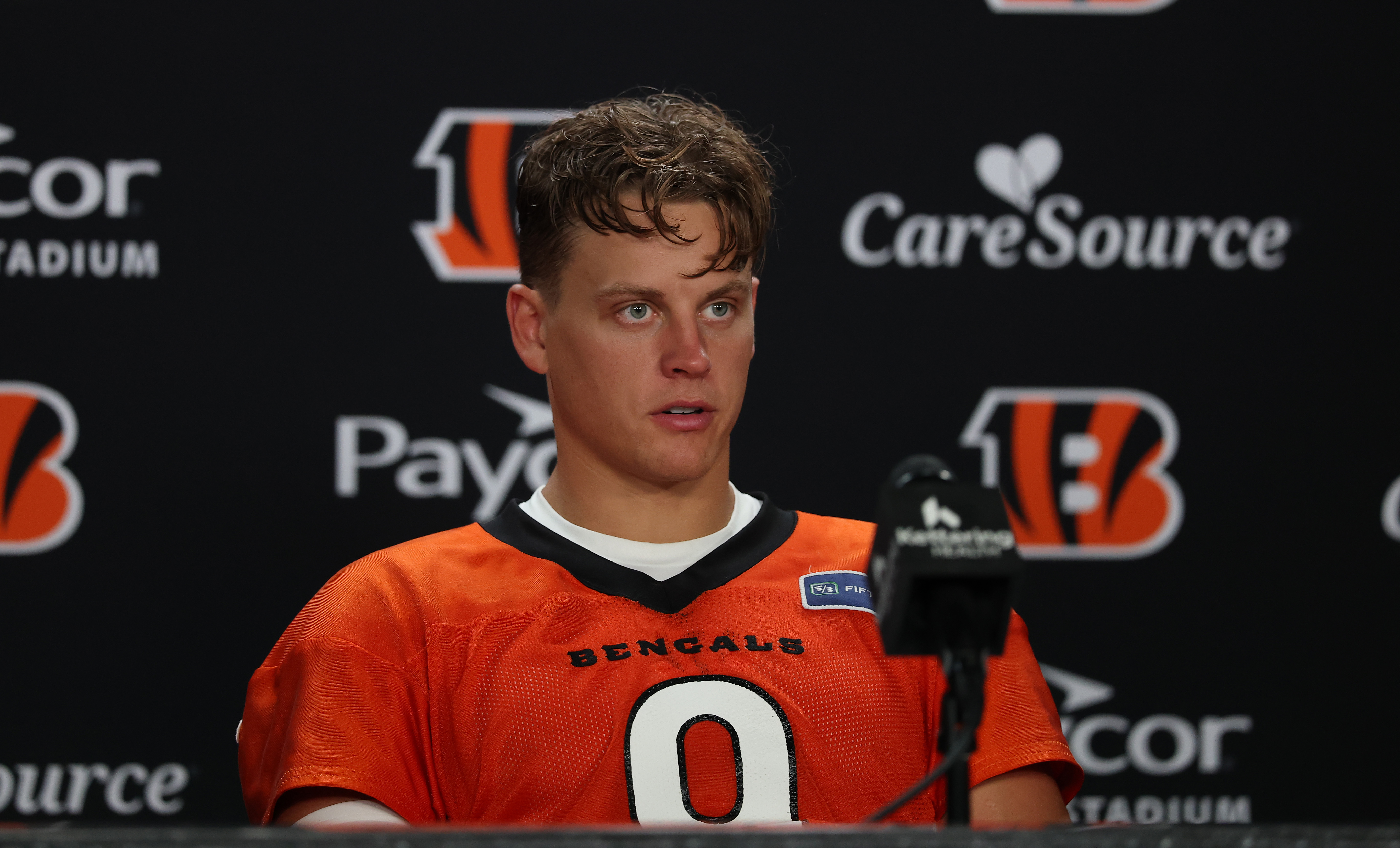 CINCINNATI, OHIO - JULY 29: Joe Burrow #9 of the Cincinnati Bengals talks to the media during Cincinnati Bengals Training Camp at Kettering Health Practice Fields on July 29, 2026 in Cincinnati, Ohio. (Photo by Andy Lyons/Getty Images)