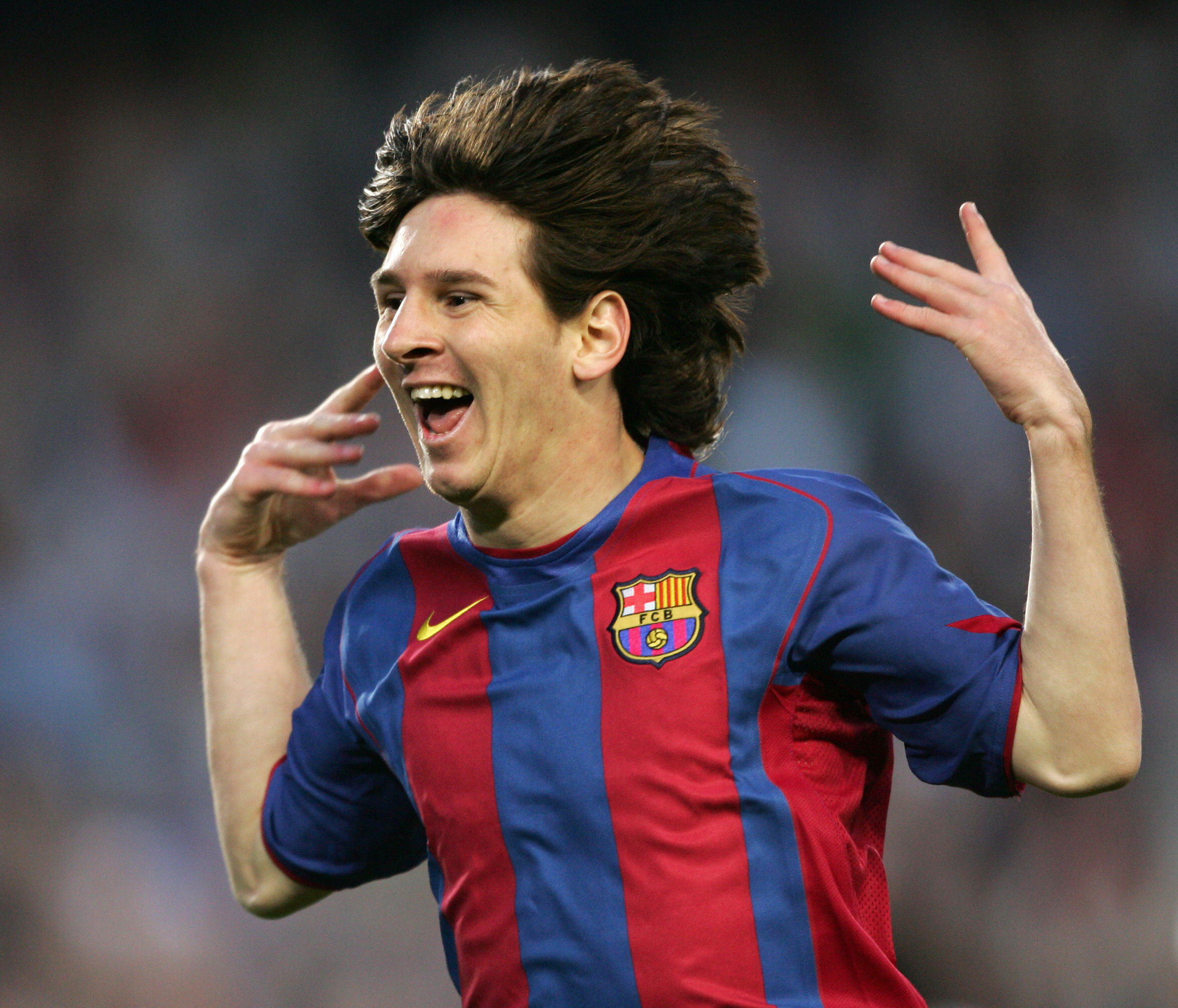 BARCELONA, SPAIN:  FC Barcelona's Argentinian Messi celebrates his goal against Albacete during their Spanish League football match at the Camp Nou stadium in Barcelona, 01 May 2005. FC Barcelona won 2-0. AFP PHOTO/LLUIS GENE.  (Photo credit should read LLUIS GENE/AFP via Getty Images)