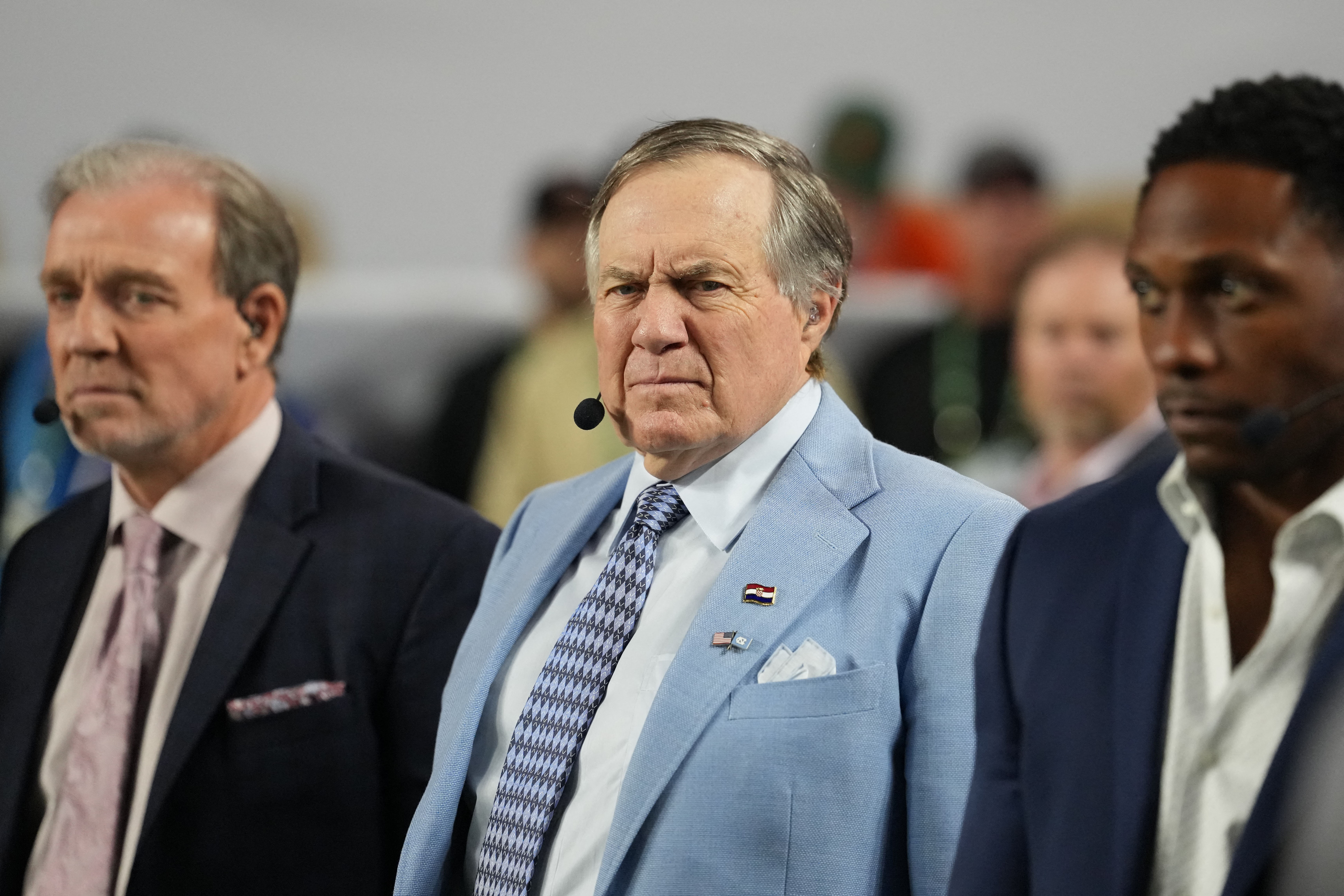 Jan 19, 2026; Miami Gardens, FL, USA; TV analyst Bill Belichick watches the Miami Hurricanes play the Indiana Hoosiers during the first half of the College Football Playoff National Championship game at Hard Rock Stadium. Mandatory Credit: Kirby Lee-Imagn Images