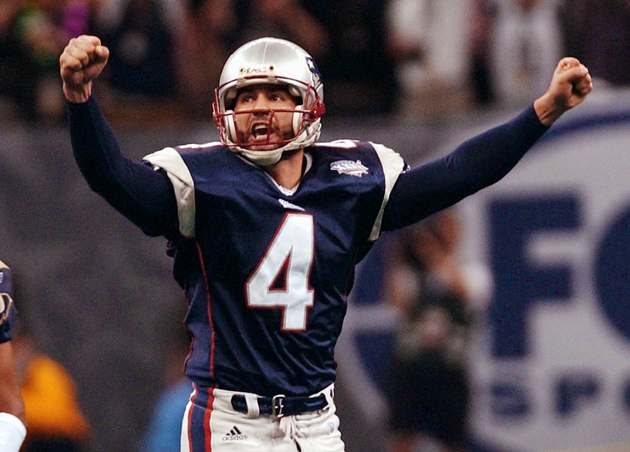 New England Patriots kicker Adam Vinatieri celebrates his game-winning field goal in Super Bowl XXXVI to beat the Rams. (Photo credit should read STAN HONDA/AFP via Getty Images)