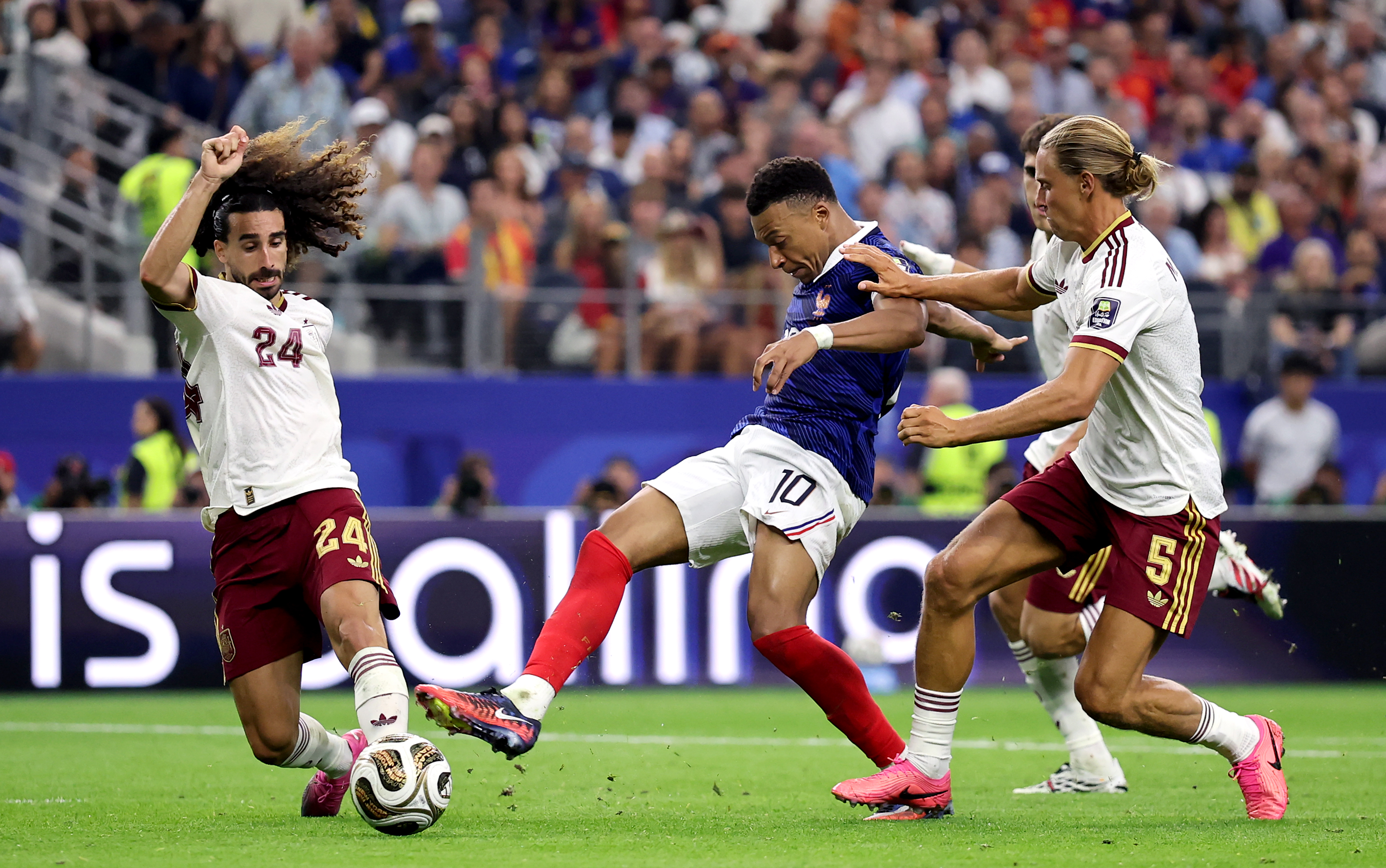 ARLINGTON, TEXAS - JULY 14: Kylian Mbappe #10 of France shoots and misses a chance against Marc Cucurella #24 of Spain during the FIFA World Cup 2026 Semi Final match between France and Spain at Dallas Stadium on July 14, 2026 in Arlington, Texas. (Photo by Hector Vivas - FIFA/FIFA via Getty Images)