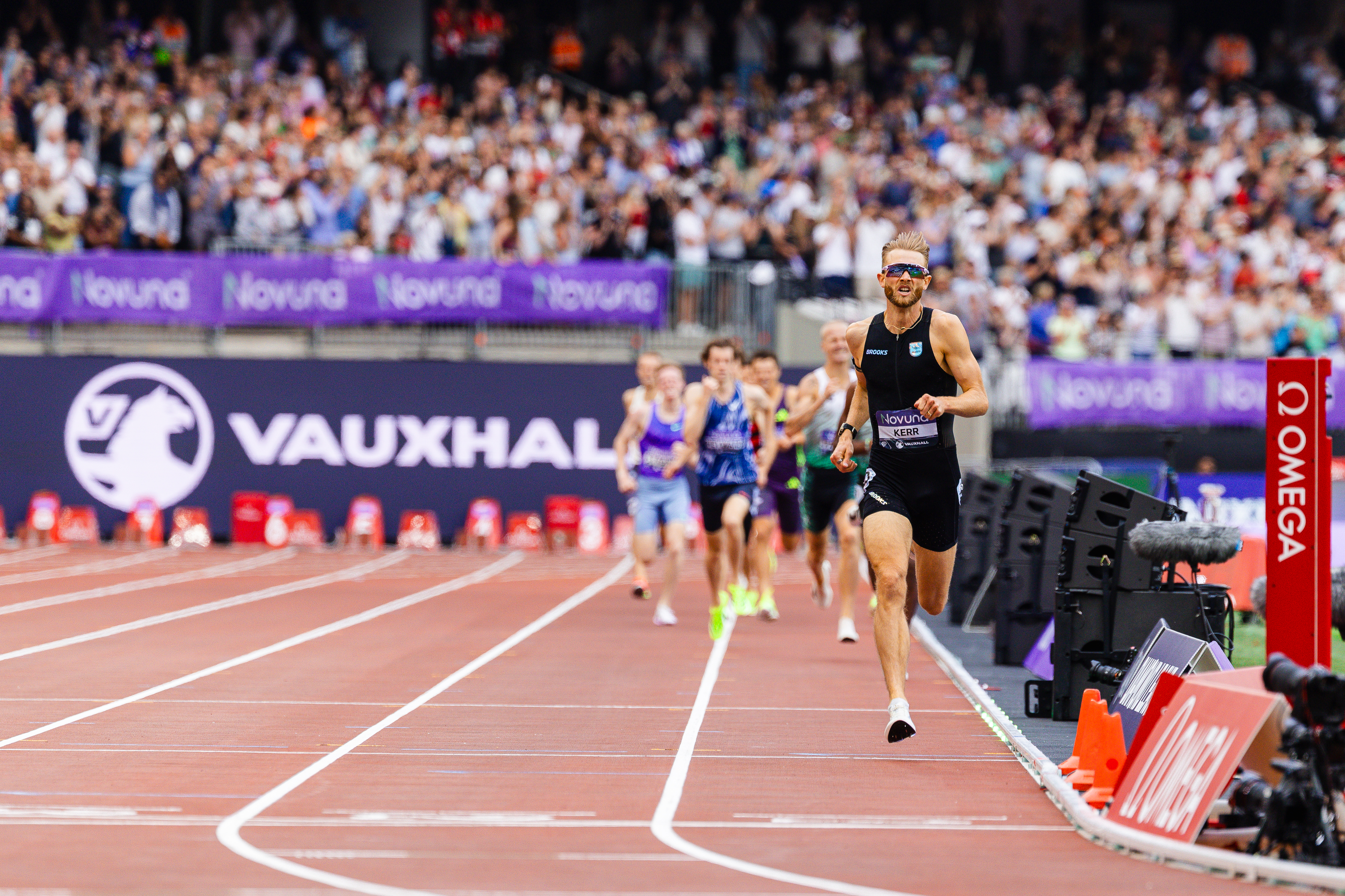 LONDON, UNITED KINGDOM - 2026/07/18: Britain's Josh Kerr charges towards the finish line during the men's mile at the London Diamond League meeting at London Stadium. Britain's Josh Kerr broke the men's mile world record at the London Diamond League meeting on 18 July 2026, clocking 3:42.66 to surpass the previous mark of 3:43.13 set by Morocco's Hicham El Guerrouj in Rome in 1999. El Guerrouj's record had stood for 27 years and was widely regarded as one of athletics' most enduring achievements. In front of a sold-out crowd of approximately 60,000 spectators at London Stadium, Kerr delivered the standout performance of the world's largest one-day athletics meeting, becoming the first British man in more than four decades to hold the world record over the mile. The meeting also served as a key final preparation opportunity for many athletes ahead of the Glasgow 2026 Commonwealth Games. (Photo by Michael Thomas/SOPA Images/LightRocket via Getty Images)