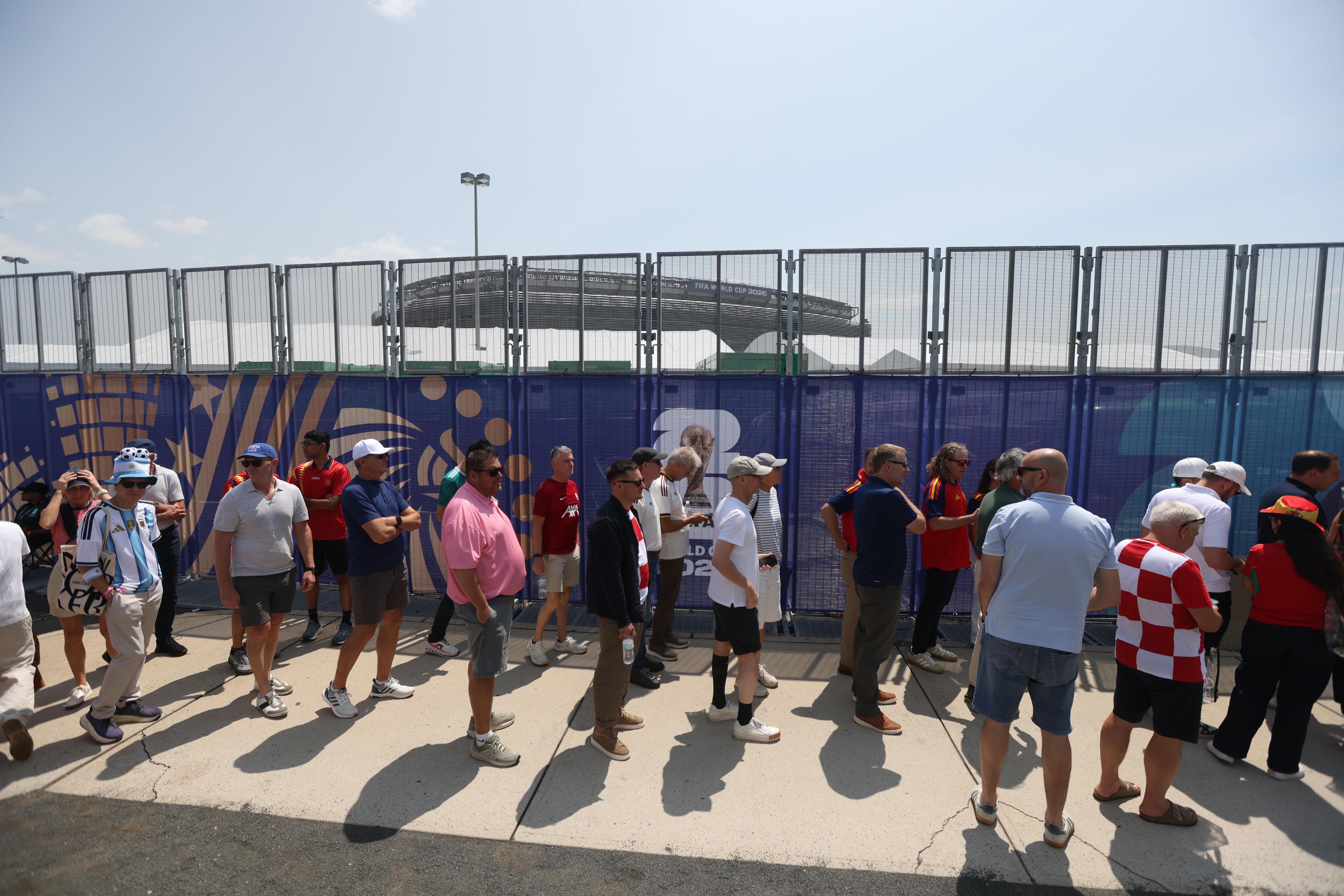 EAST RUTHERFORD, NEW JERSEY - JULY 19: Fans wait in line to enter the stadium perimeter before the FIFA World Cup 2026 Final match between Spain and Argentina at New York New Jersey Stadium on July 19, 2026 in East Rutherford, New Jersey. (Photo by Doug Zimmerman/ISI Photos/ISI Photos via Getty Images)