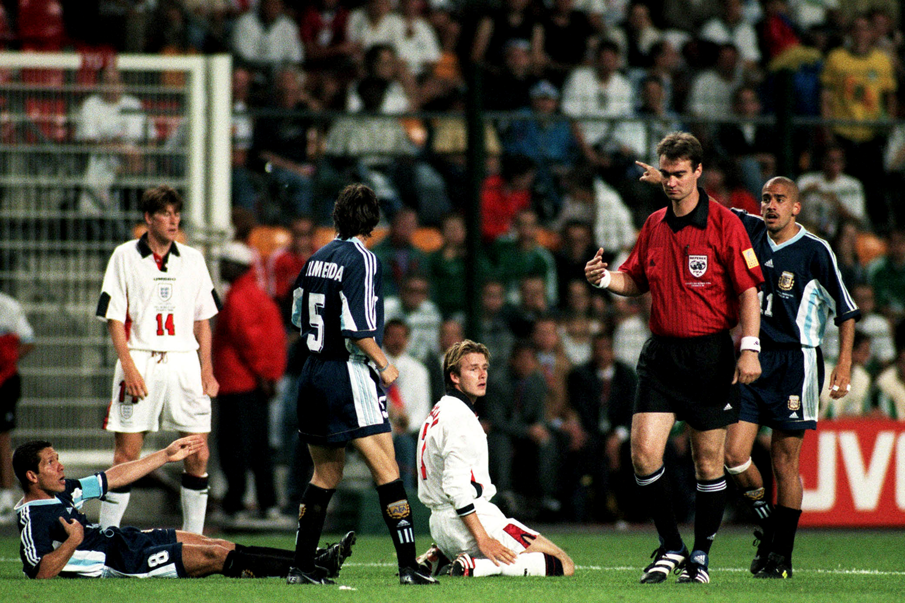 SAINT-ETIENNE, FRANCE - June 30: Diego Simeone of Argentina complains as David Beckham of England Is Sent Off by referee Kim Milton Nielsen during the FIFA World Cup Finals 1998 Round Of 16 match between Argentina and England at Stade Geoffroy-Guichard on June 30, 1998 in Saint-Etienne, France. (Photo by Richard Sellers/Sportsphoto/Allstar via Getty Images)