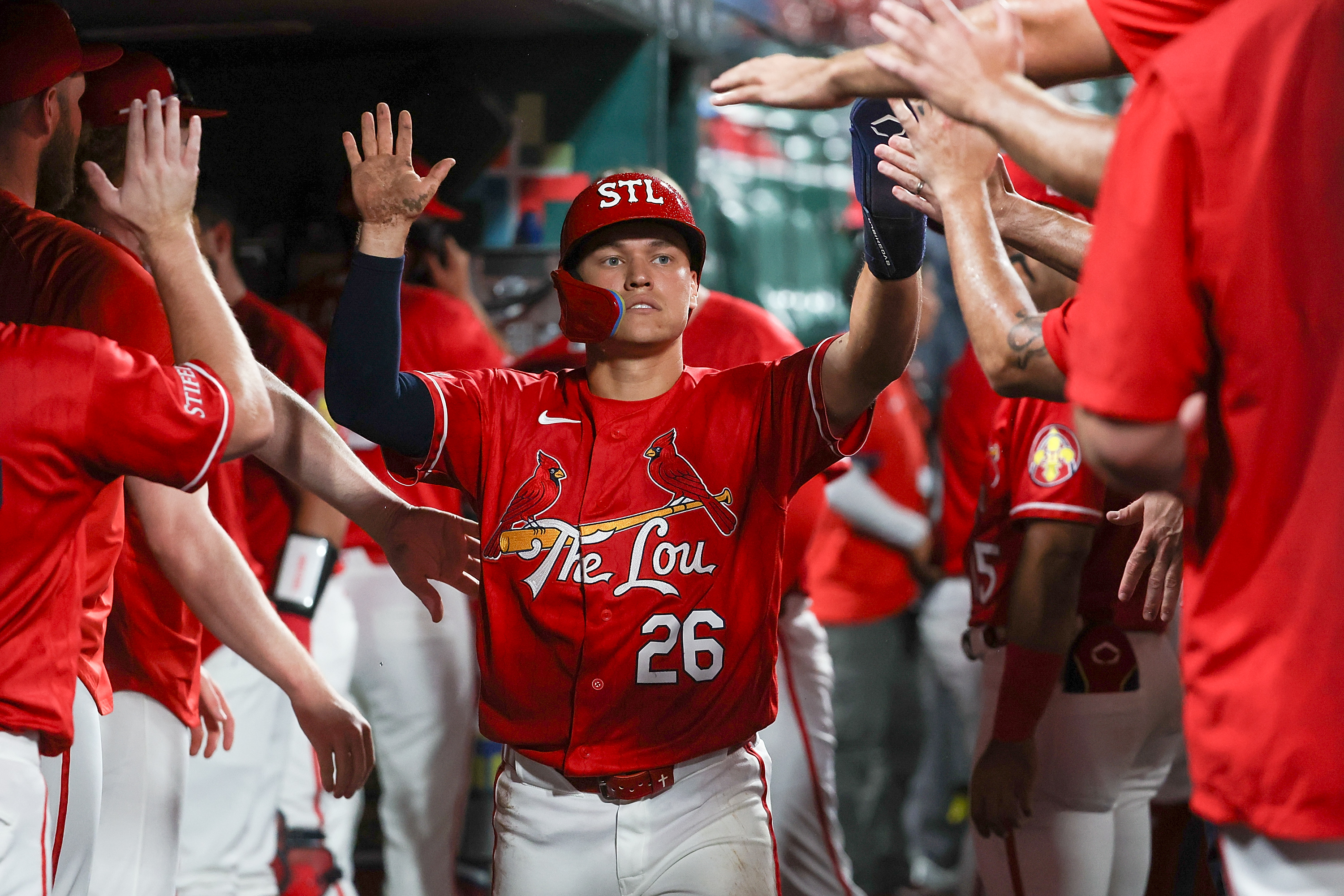 St. Louis Cardinals' JJ Wetherholt is congratulated by teammates after scoring a run during the sixth inning of a baseball game against the Atlanta Braves Friday, July 10, 2026, in St. Louis. (AP Photo/Scott Kane)