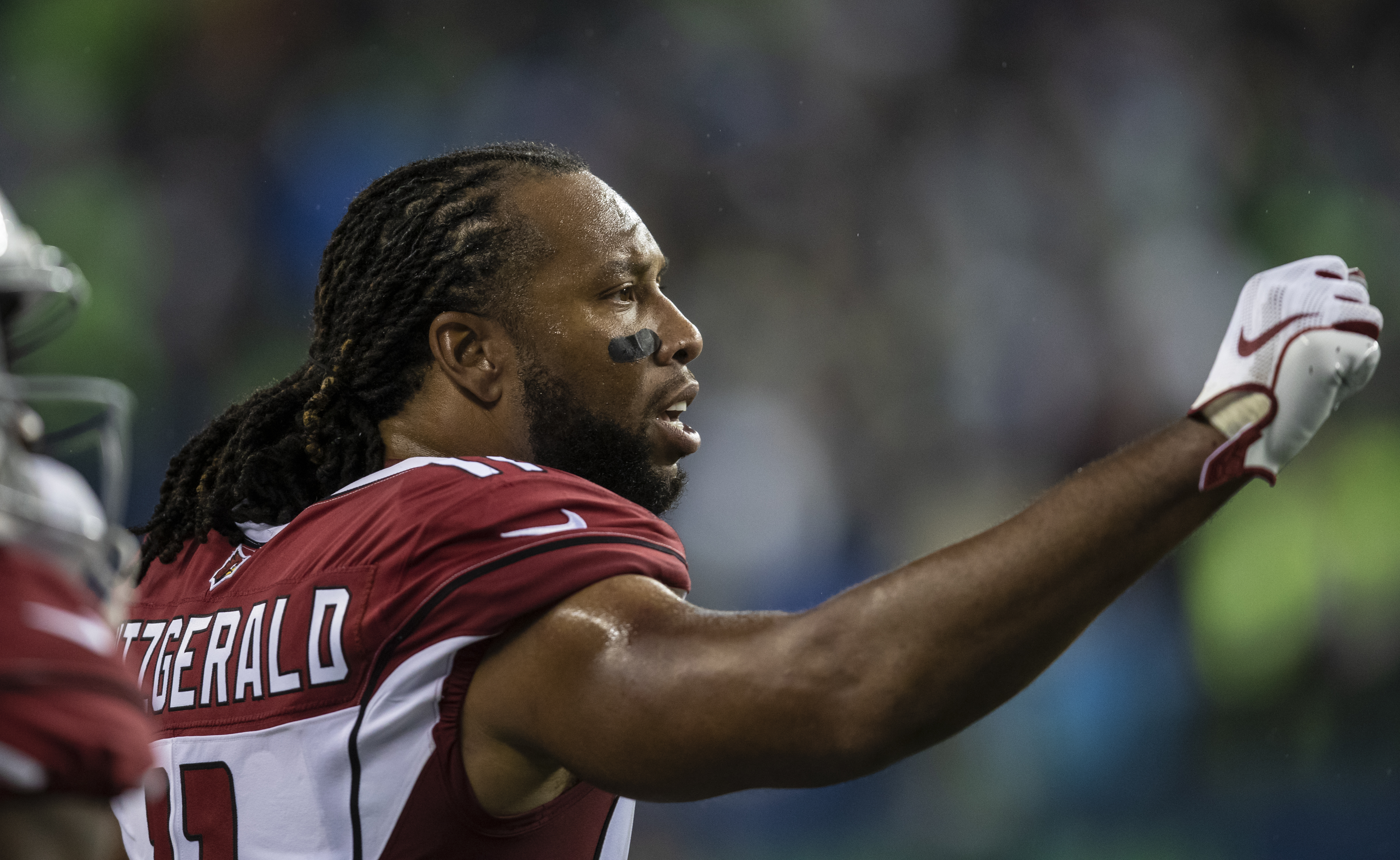 Former Cardinals receiver Larry Fitzgerald from the sideline during game against the Seattle Seahawks on December 22, 2019 in Seattle, Washington. (Photo by Stephen Brashear/Getty Images)