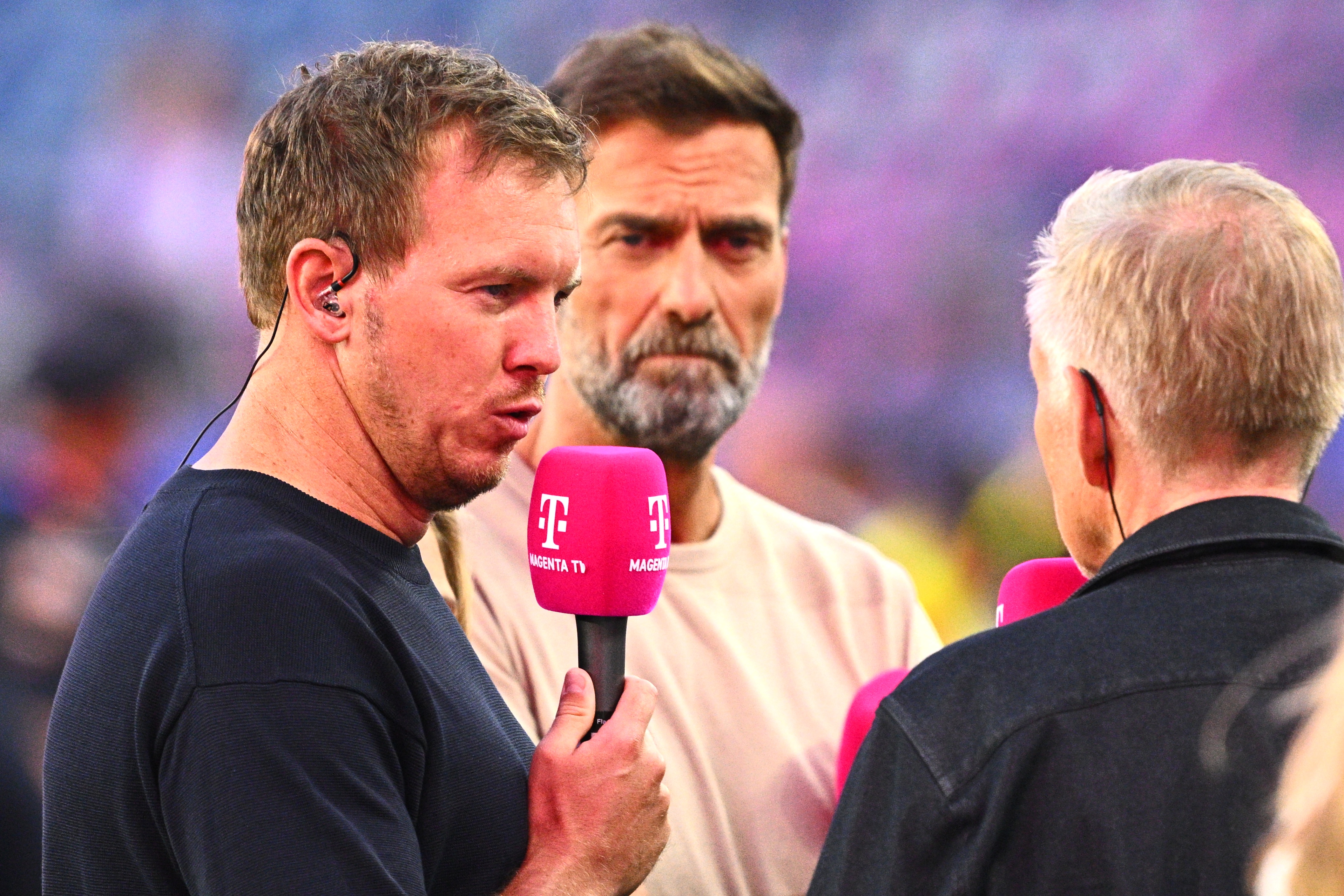 30 June 2026, USA, Foxborough: Soccer, Men, 2026 World Cup, National Team, Germany vs. Paraguay, Round of 32 at Boston Stadium, German national team coach Julian Nagelsmann (L) in an interview with TV analyst Jürgen Klopp (C) and host Johannes B. Kerner. PLEASE NOTE: In accordance with FIFA regulations, these images may be used exclusively for editorial purposes. Commercial use is prohibited. Furthermore, no video-like sequences may be created, and no alterations may be made to the image, either in the foreground or the background. Photo: Tom Weller/dpa (Photo by Tom Weller/picture alliance via Getty Images)