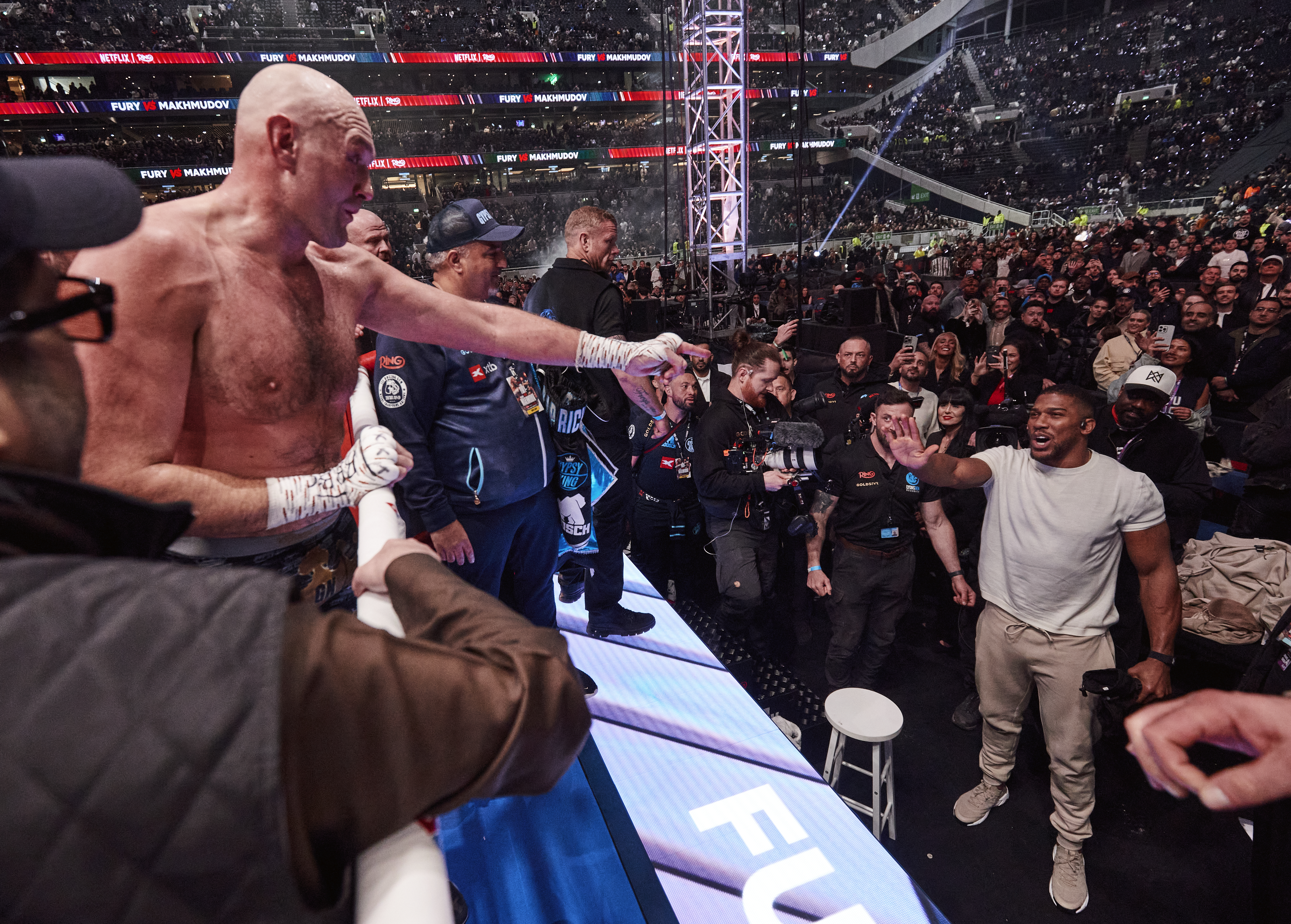LONDON, ENGLAND - APRIL 11: Tyson Fury exchanges words with Anthony Joshua after his fight at Tottenham Hotspur Stadium on April 11, 2026 in London, England. (Photo by Mark Robinson/Getty Images)
