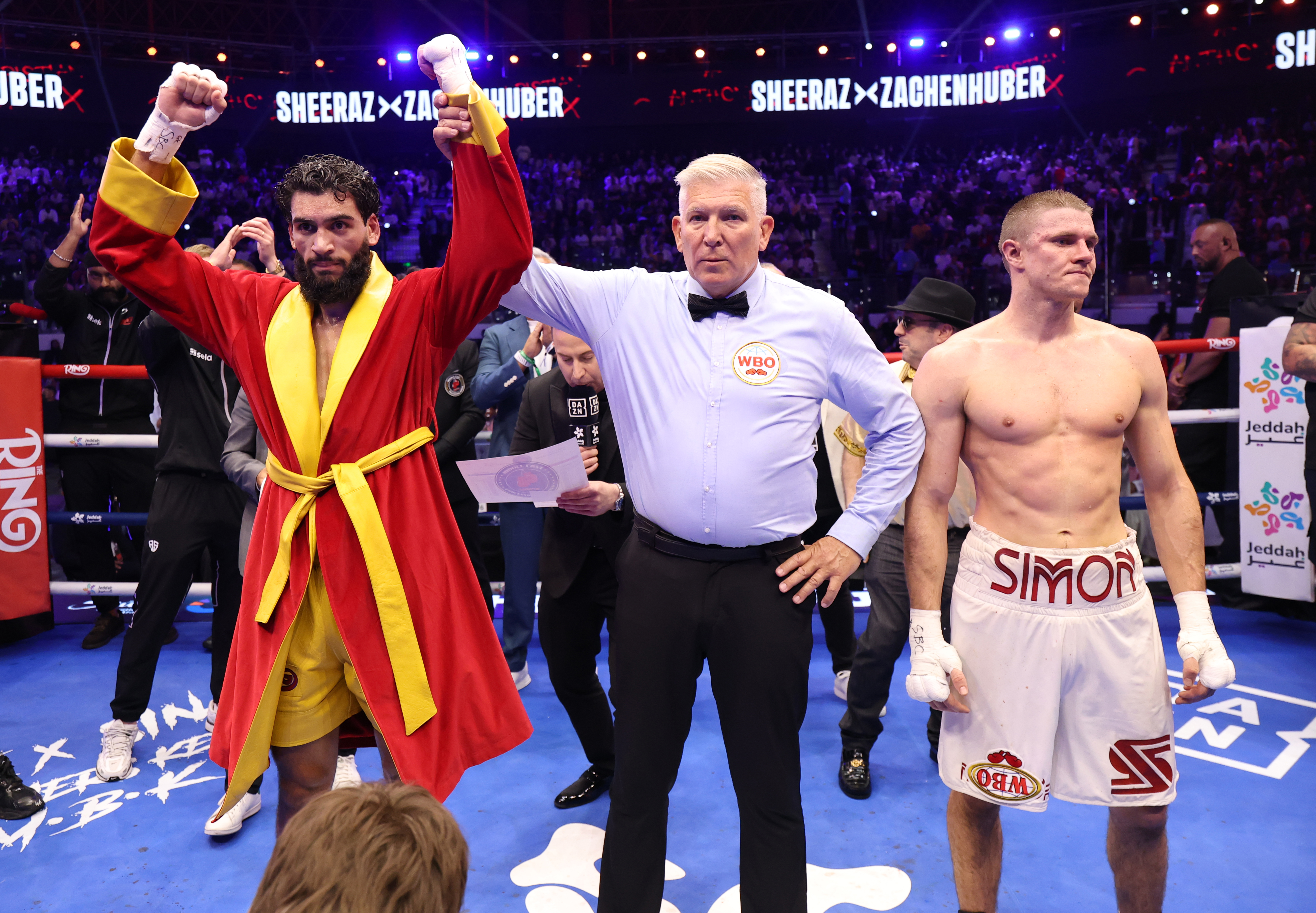 EDDAH, SAUDI ARABIA - JULY 25; Hamzah Sheeraz (red robe) wins his WBO World Super Middleweight Title contest against Simon Zachenhuber (white shorts) during the Anthony Joshua v Kristian Prenga: The Comeback fight night at Jeddah Superdome on July 25, 2026 in Jeddah, Saudi Arabia. (Photo by Mark Robinson/Matchroom Boxing/Getty Images)