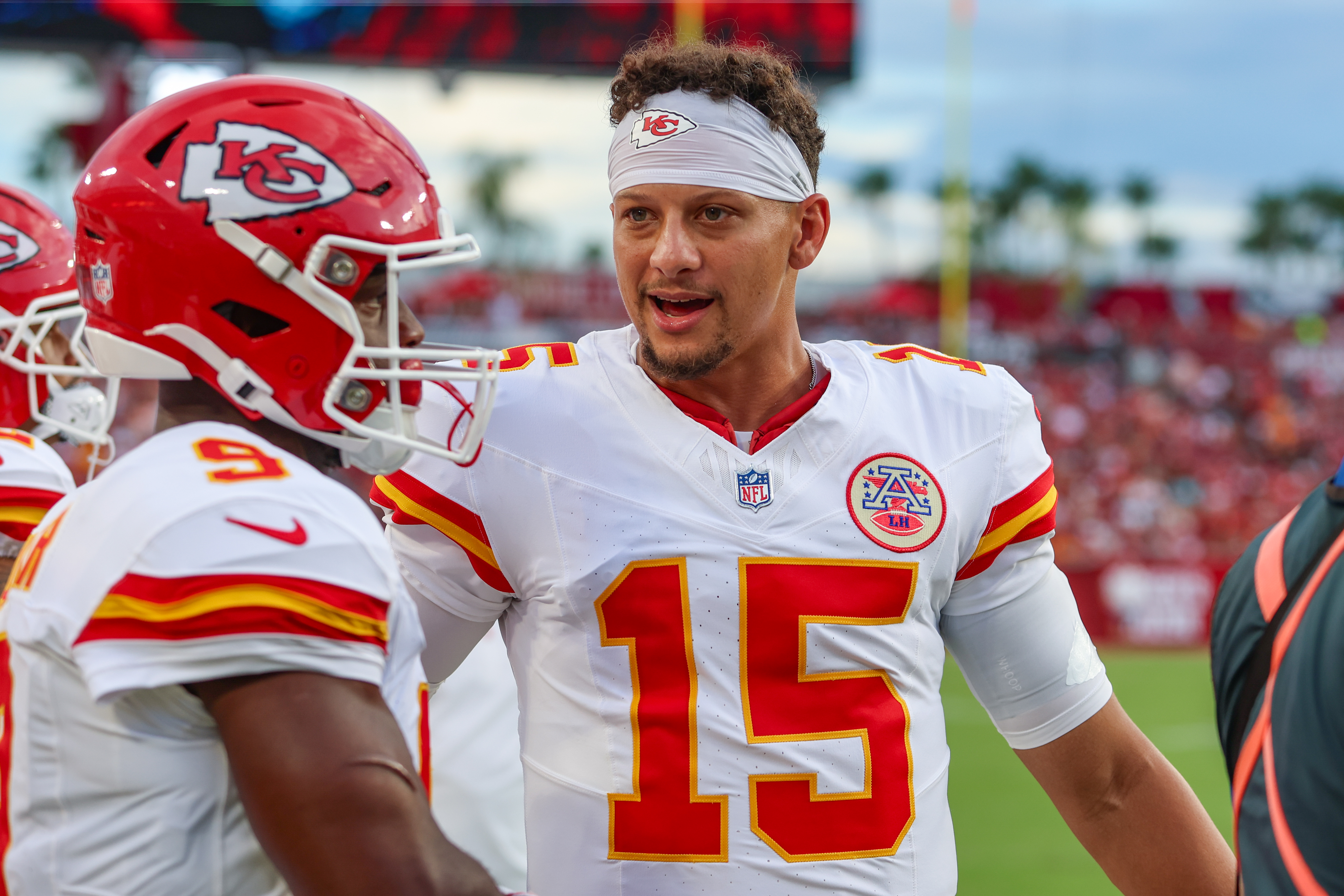 Kansas City Chiefs quarterback Patrick Mahomes (15) talks with running back Kenneth Walker III (9) om the sideline during an NFL preseason football game against the Tampa Bay Buccaneers in Tampa, Fla., Saturday, Aug. 22, 2026. (AP Photo/Gary McCullough)