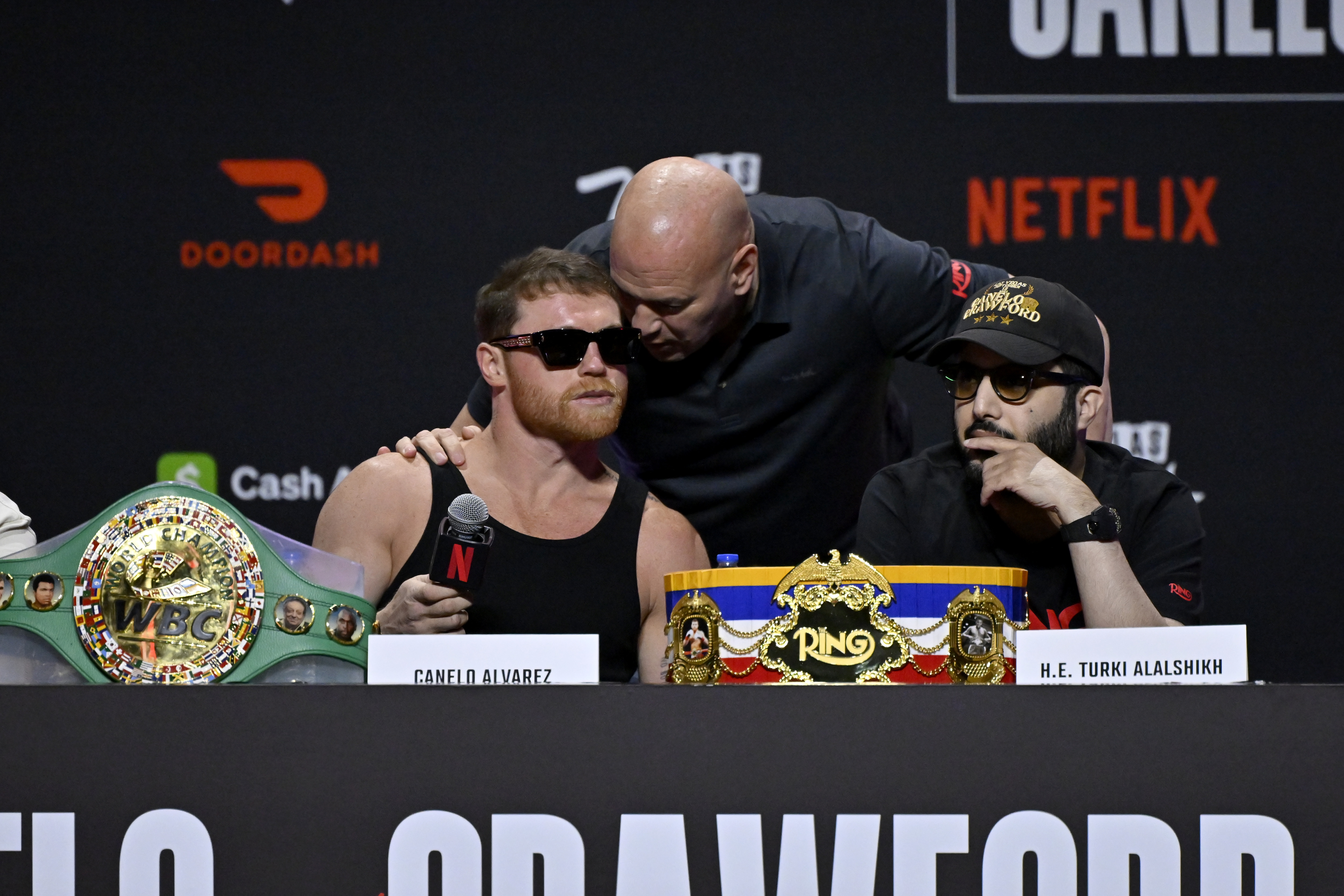 LAS VEGAS, NEVADA - SEPTEMBER 11: (L-R) Canelo Álvarez, Dana White and H.E. Turki Alalshikh speak onstage during Netflix's Canelo vs Crawford press conference at T-Mobile Arena on September 11, 2025 in Las Vegas, Nevada.  (Photo by David Becker/Getty Images for Netflix)