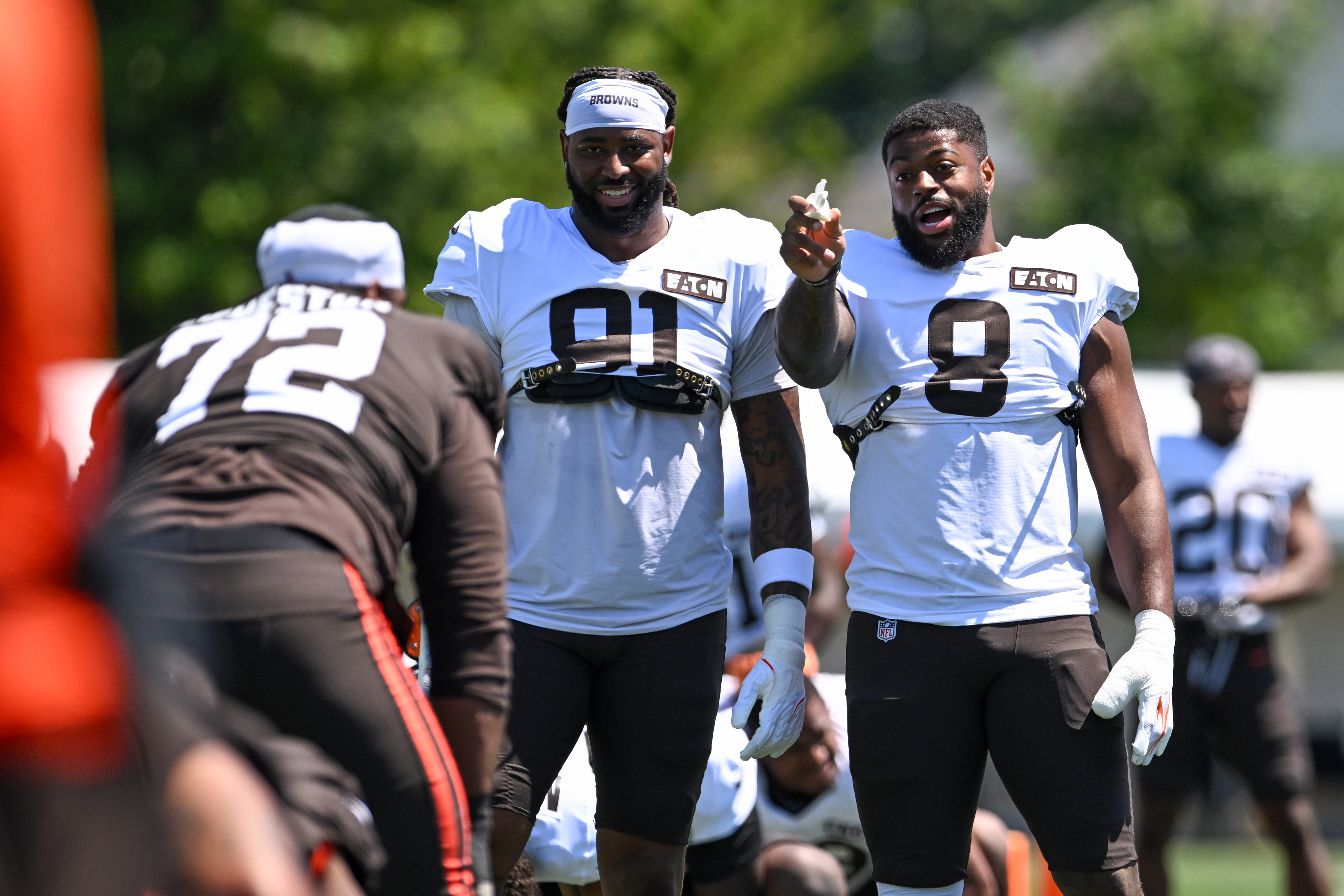 BEREA, OHIO - AUGUST 03: Alex Wright #91 and Jared Verse #8 of the Cleveland Browns joke with KT Leveston #72 during the Cleveland Browns Training Camp at CrossCountry Mortgage Campus on August 03, 2026 in Berea, Ohio. (Photo by Nick Cammett/Getty Images)
