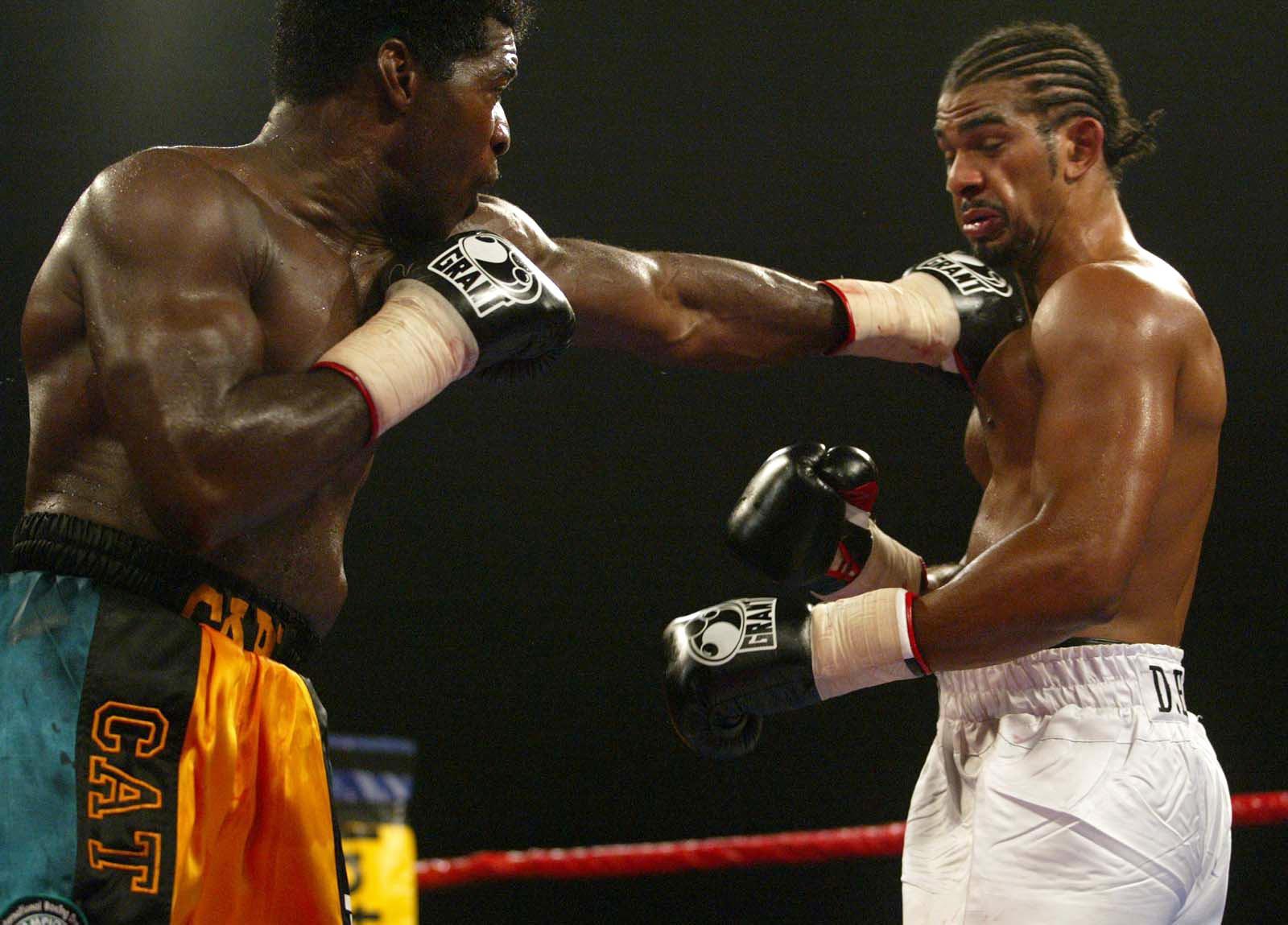 Carl Thompson, left, on his way to retaining his IBO Cruiserweight title, at Wembley Arena, Friday 10th September 2004. Thompson stopped challenger  David Haye in the fifth round.   (Photo by Mark Lees - PA Images/PA Images via Getty Images)