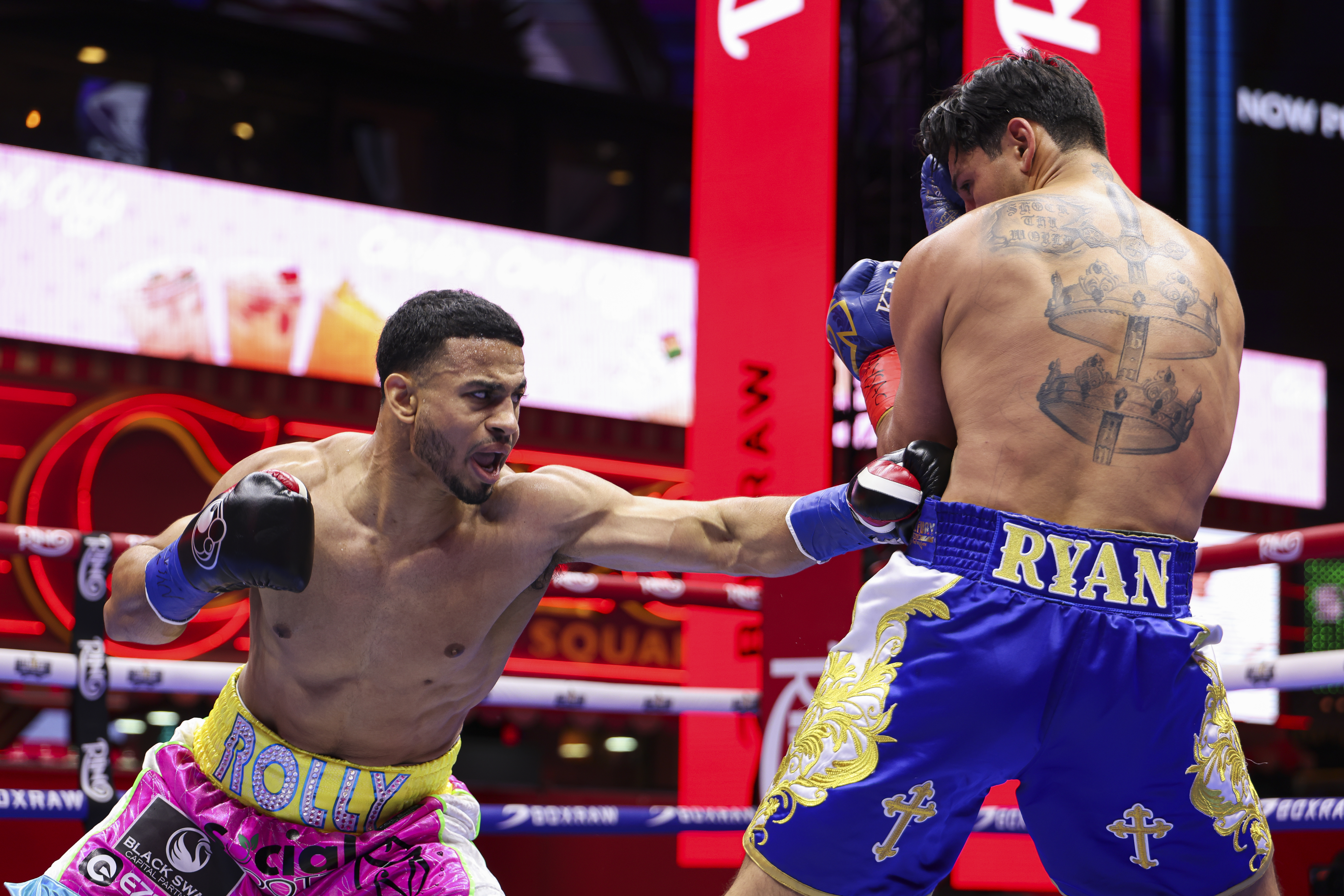 NEW YORK, NEW YORK - MAY 02: Rolly Romero lands a punch on Ryan Garcia during a fight for the WBA Welterweight title in Times Square on May 02, 2025 in New York City.  (Photo by Cris Esqueda/Golden Boy/Getty Images)