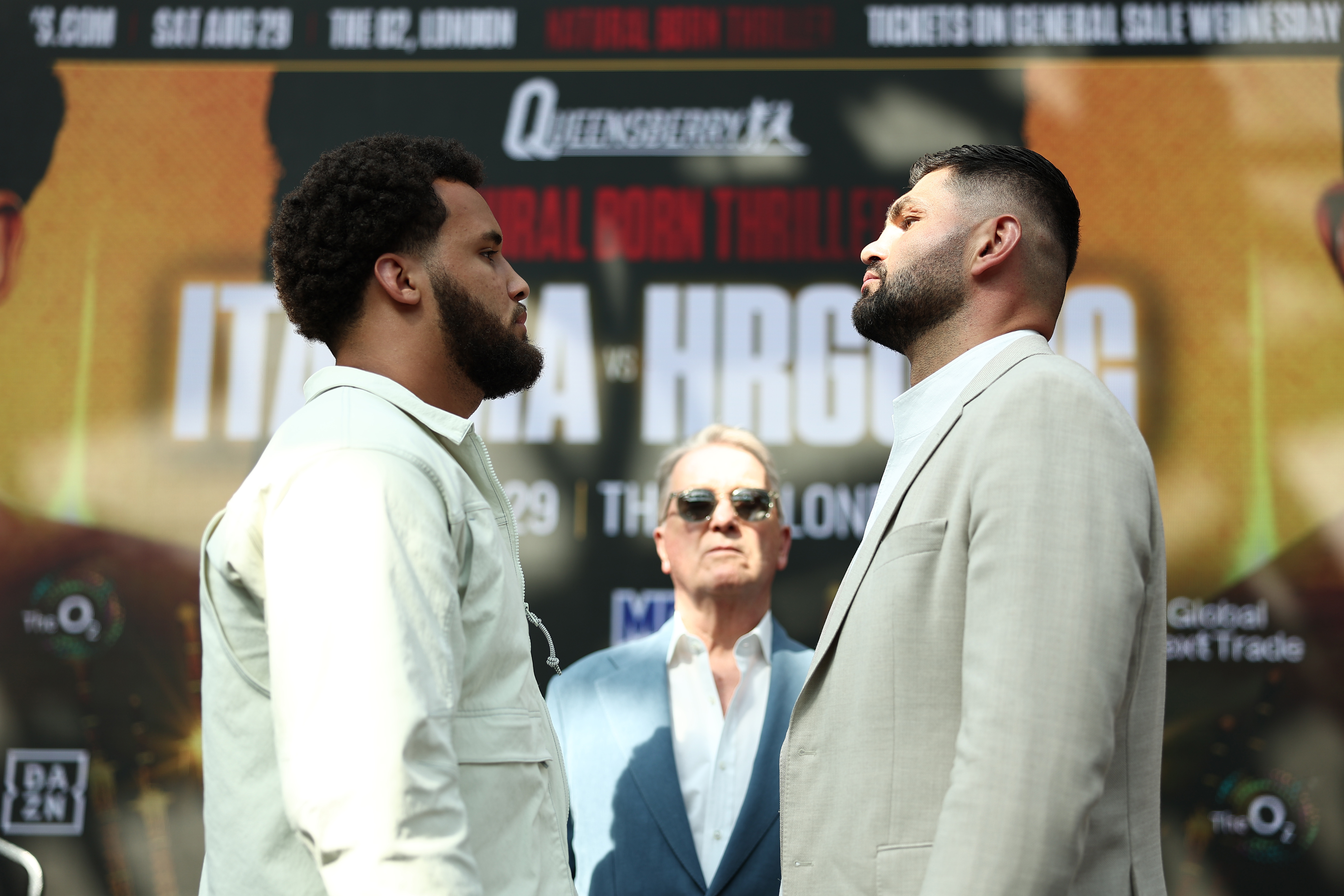 LONDON, ENGLAND - JUNE 22: Moses Itauma (L) and Filip Hrgovic (R) face off as Frank Warren, Founder of Queensbury Promotions (C), watches on following a press conference ahead of their heavyweight fight on the 'Natural Born Thriller' card at Studio 338 on June 22, 2026 in London, England. (Photo by James Fearn/Getty Images)