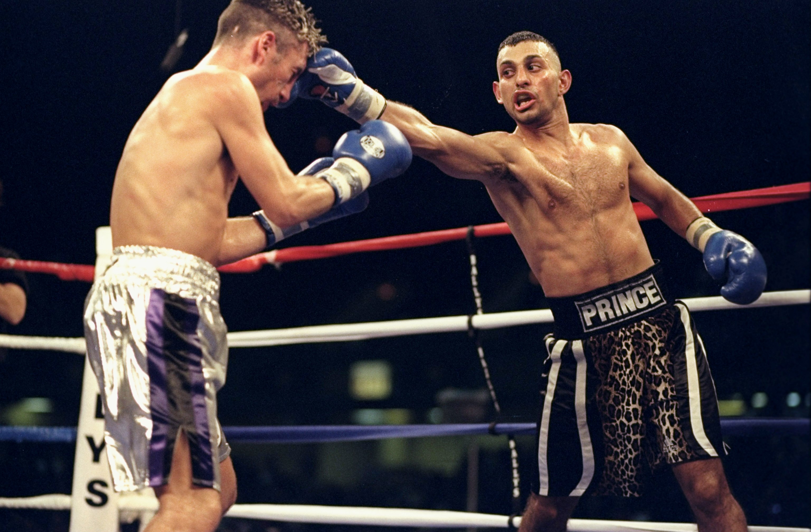 31 Oct 1998:  Prince Naseem Hamed (right) in action during the Prince Naseem Hamed v Wayne McCullough fight for the WBO belt at the Atlantic City Convention Center in Atlantic City, New Jersey. Prince Naseem Hamed defeated Wayne McCullough by a decision in the 12th round. Mandatory Credit: Al Bello  /Allsport
