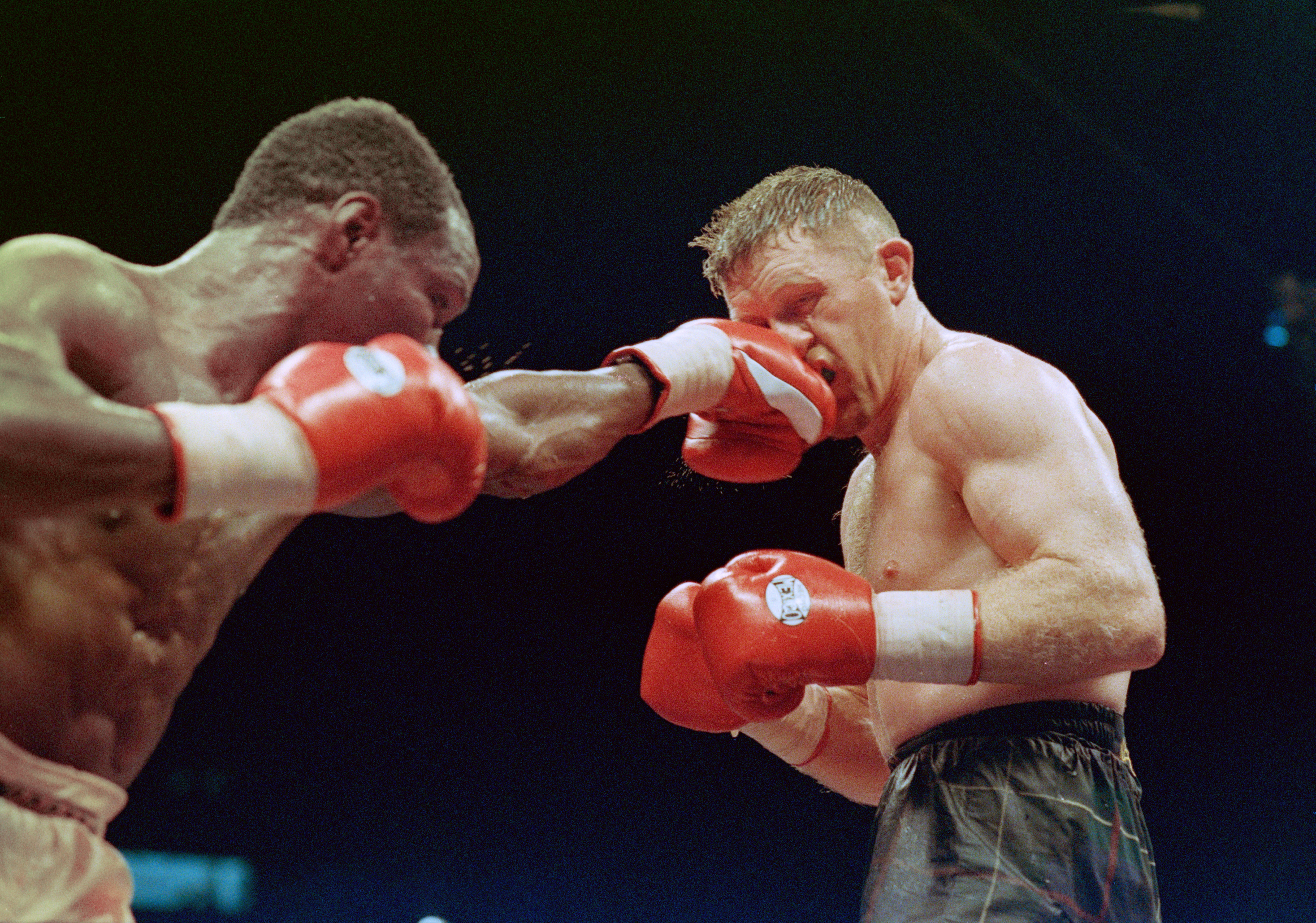 Boxers Chris Eubank (left) and Steve Collins competing in a WBO super middleweight title fight at Green Glens Arena, Millstreet, Ireland, 18th March 1995. Collins beat the previously undefeated Eubank to take the title. (Photo by Getty Images)