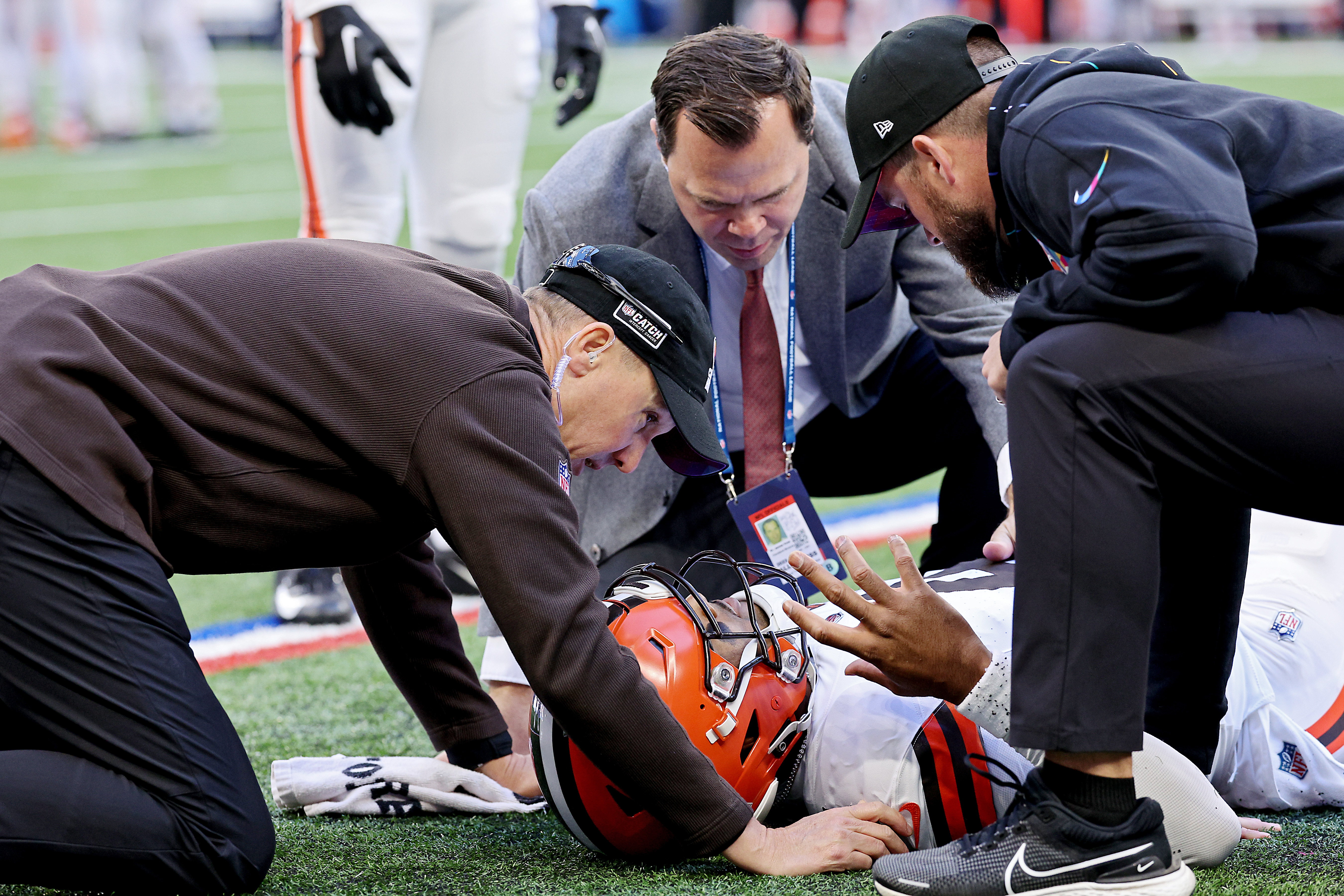 INDIANAPOLIS, INDIANA - OCTOBER 22: Deshaun Watson #4 of the Cleveland Browns is attended to by medical staff after an apparent injury during the second quarter against the Indianapolis Colts at Lucas Oil Stadium on October 22, 2023 in Indianapolis, Indiana. (Photo by Michael Hickey/Getty Images)