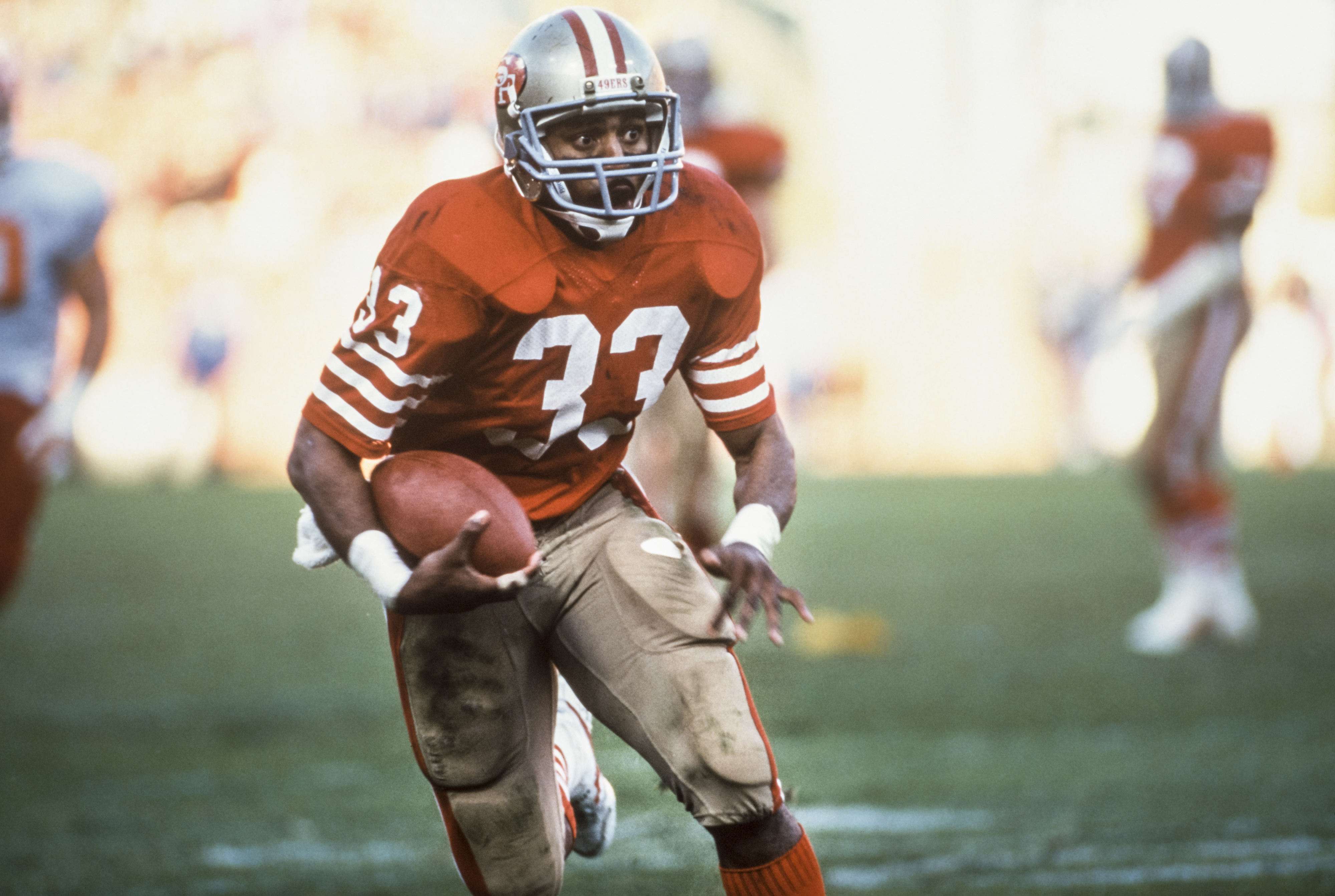 SAN FRANCISCO -  AUGUST 8:  Roger Craig #33 of the San Francisco 49ers runs the ball during a National Football League pre season game against the Kansas City Chiefs played on August 8, 1987 at Candlestick Park in San Francisco, California.    (Photo by David Madison/Getty Images) 