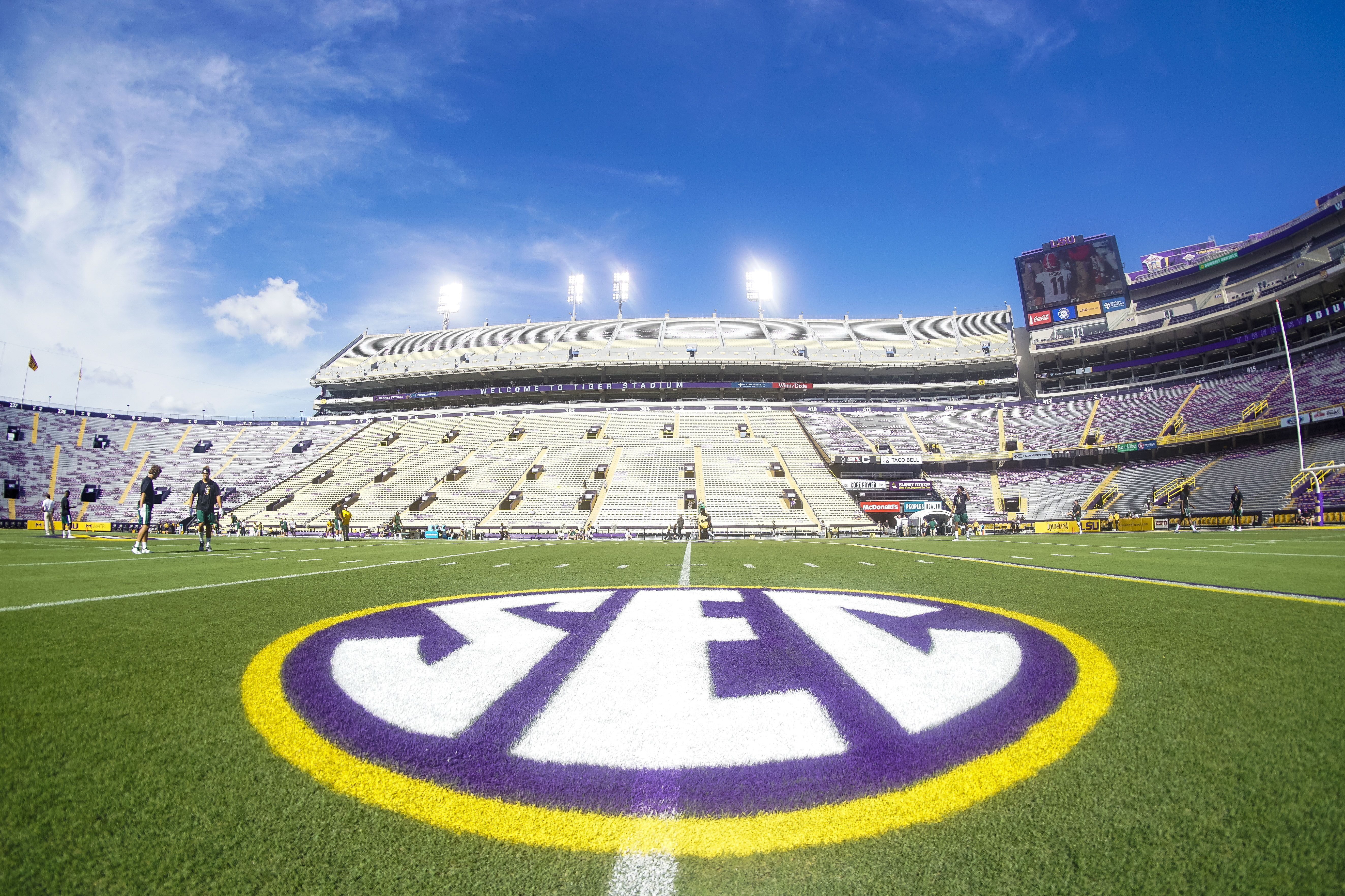 SEC school leaders exploring extreme steps over LSU's plan to sign former pro athletes, including potential expulsion, competition boycott and federal lawsuit