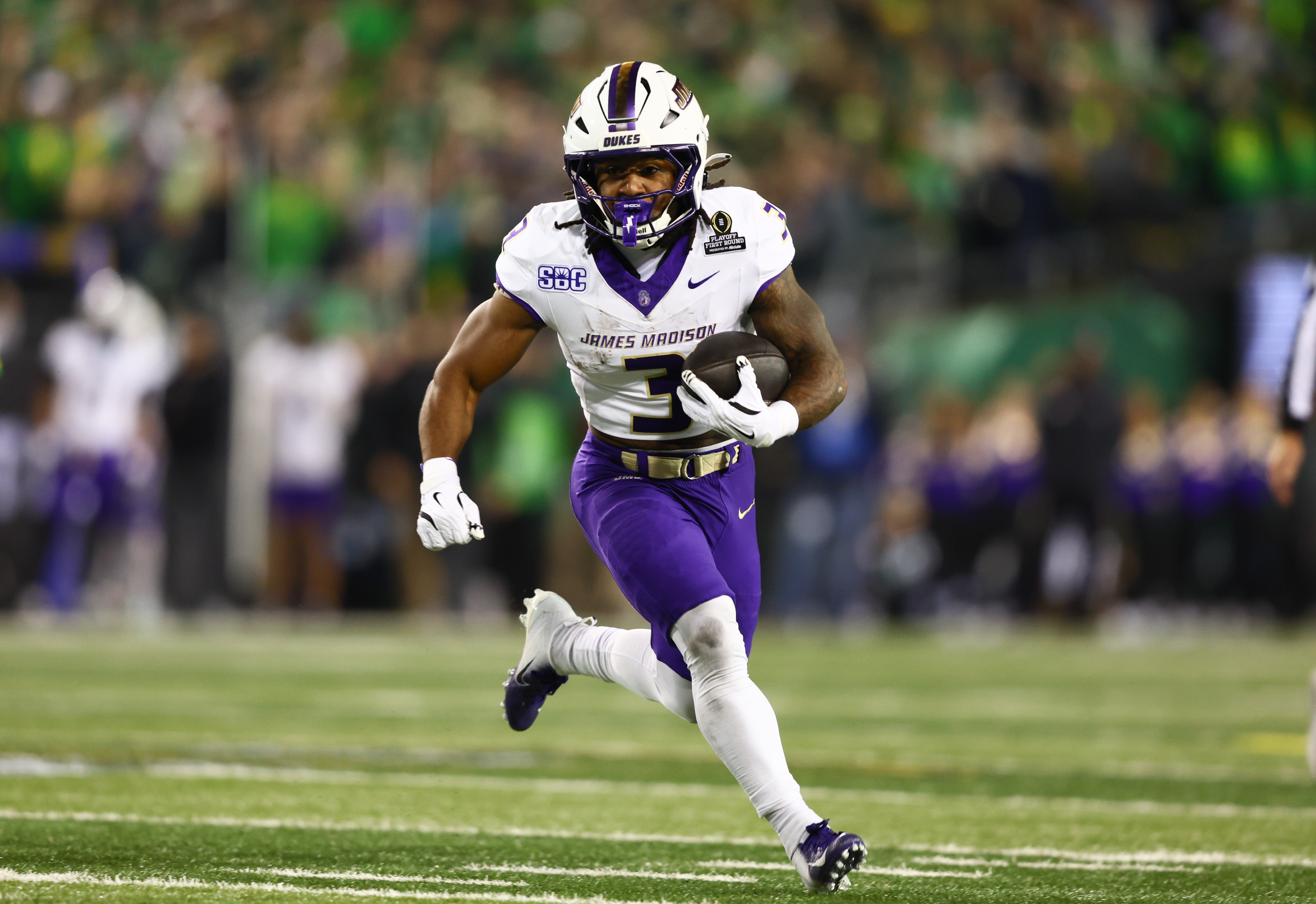 EUGENE, OREGON - DECEMBER 20: Running back Wayne Knight #3 of the James Madison Dukes runs during the first half against the Oregon Ducks  at Autzen Stadium on December 20, 2025 in Eugene, Oregon. (Photo by CFP/Getty Images)