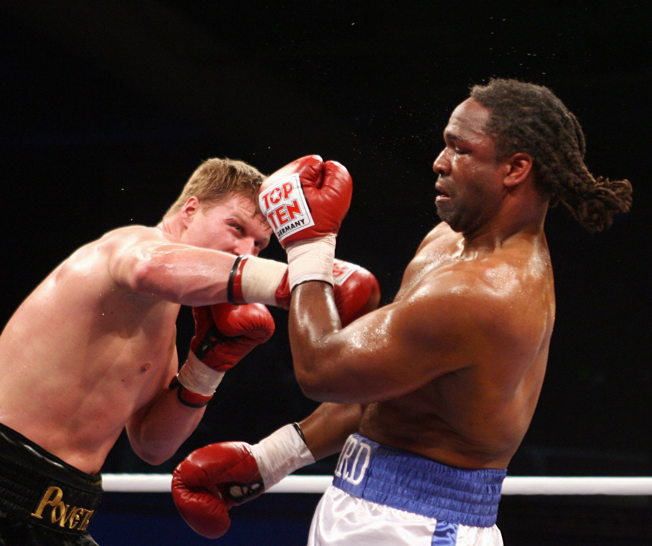 Russian heavyweight Aleksandr Povetkin (L) boxes against his opponent from the US, Chris Byrd during their IBF world championship fight in the eastern German town of Erfurt 27 October 2007. Povetkin has taken a step closer to a shot at Vladimir Klitschko's IBF world champion belt after his eleventh-round win over Chris Byrd. AFP PHOTO DDP/JENS-ULRICH KOCH GERMANY OUT (Photo credit should read JENS-ULRICH KOCH/DDP/AFP via Getty Images)